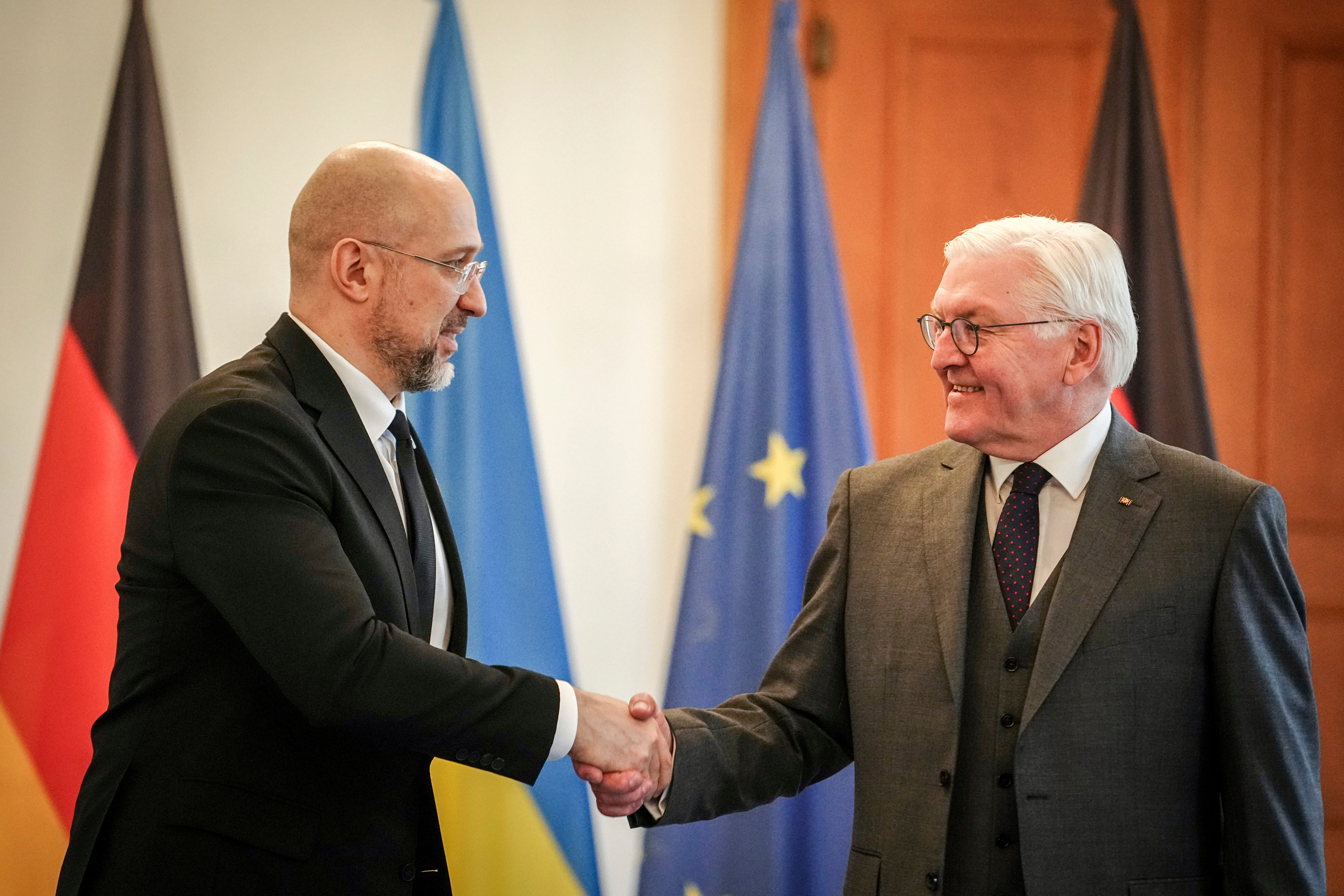<p>Ukraine’s Prime Minister Denys Shmyhal, left, shakes hands with German President Frank-Walter Steinmeier at Bellevue Palace, in Berlin on Tuesday 24 October. </p>