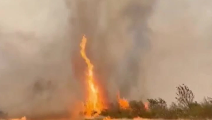 A massive 'firenado' was caught tearing through the Australian Outback.