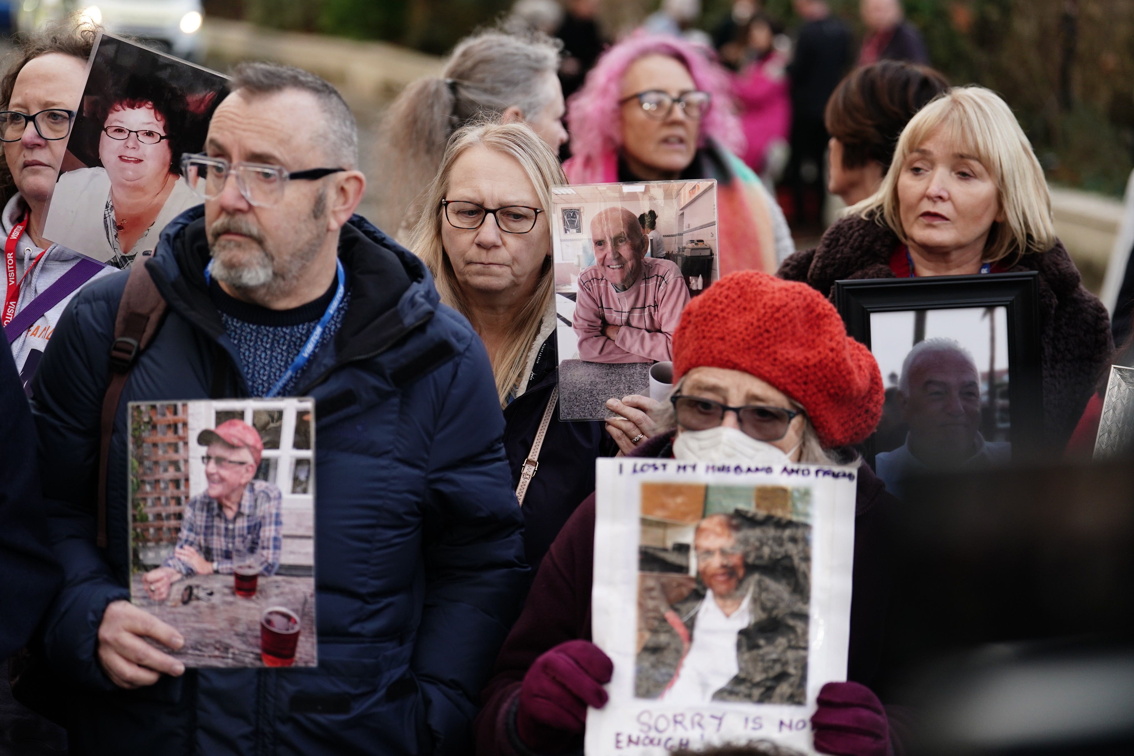 <p>Members of Covid Bereaved Families, holding photographs of their relatives who died during the pandemic, outside Dorland House in London, where Prime Minister Rishi Sunak was giving evidence to the UK Covid-19 Inquiry (Jordan Pettitt/PA)</p>