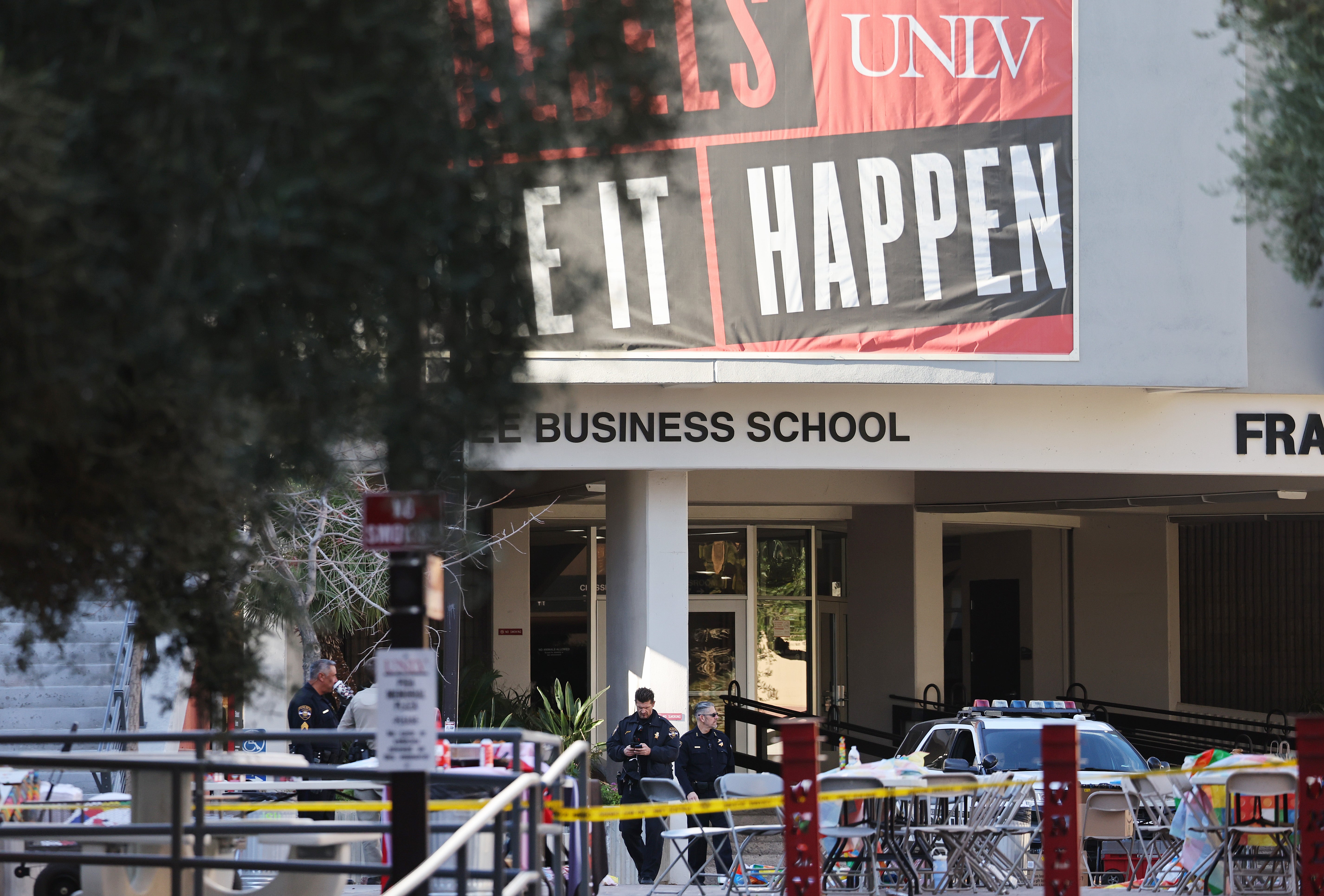 <p>Police officers keep watch near the scene outside Frank and Estella Beam Hall, where the UNLV Lee Business School is located</p>