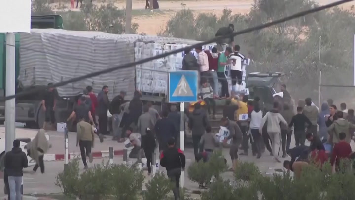 People in Gaza urgently seek assistance bundles as trucks arrive, despite a lack of communication.