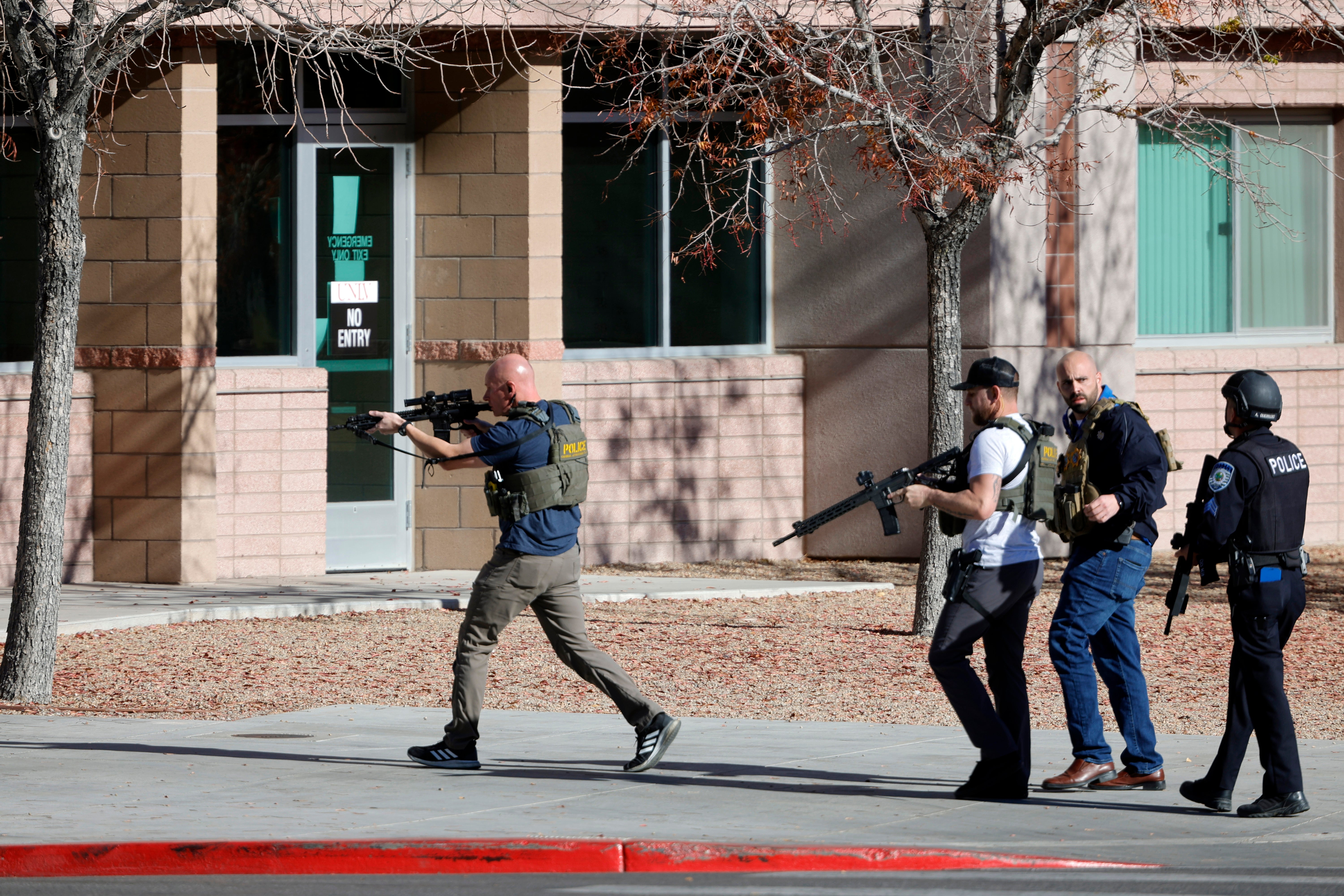 <p>Law enforcement officers head into the University of Nevada after shots fired </p>