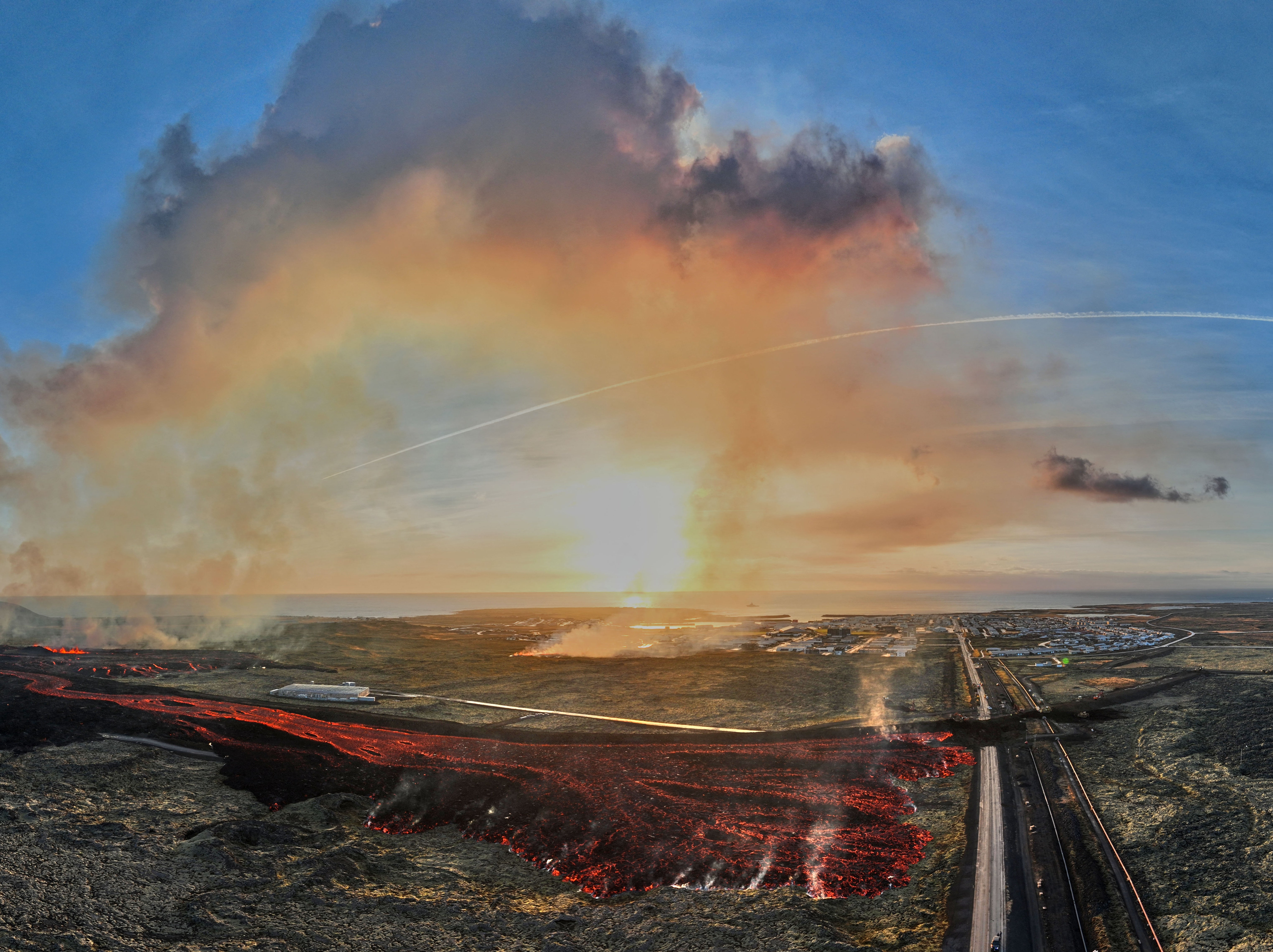 

<p>Aerial view taken on January 14, 2024 shows flowing lava close to a road leading to the southwestern Icelandic town of Grindavik </p>
<p>” height=”4558″ width=”6093″ layout=”responsive” i-amphtml-layout=”responsive”><i-amphtml-sizer slot=