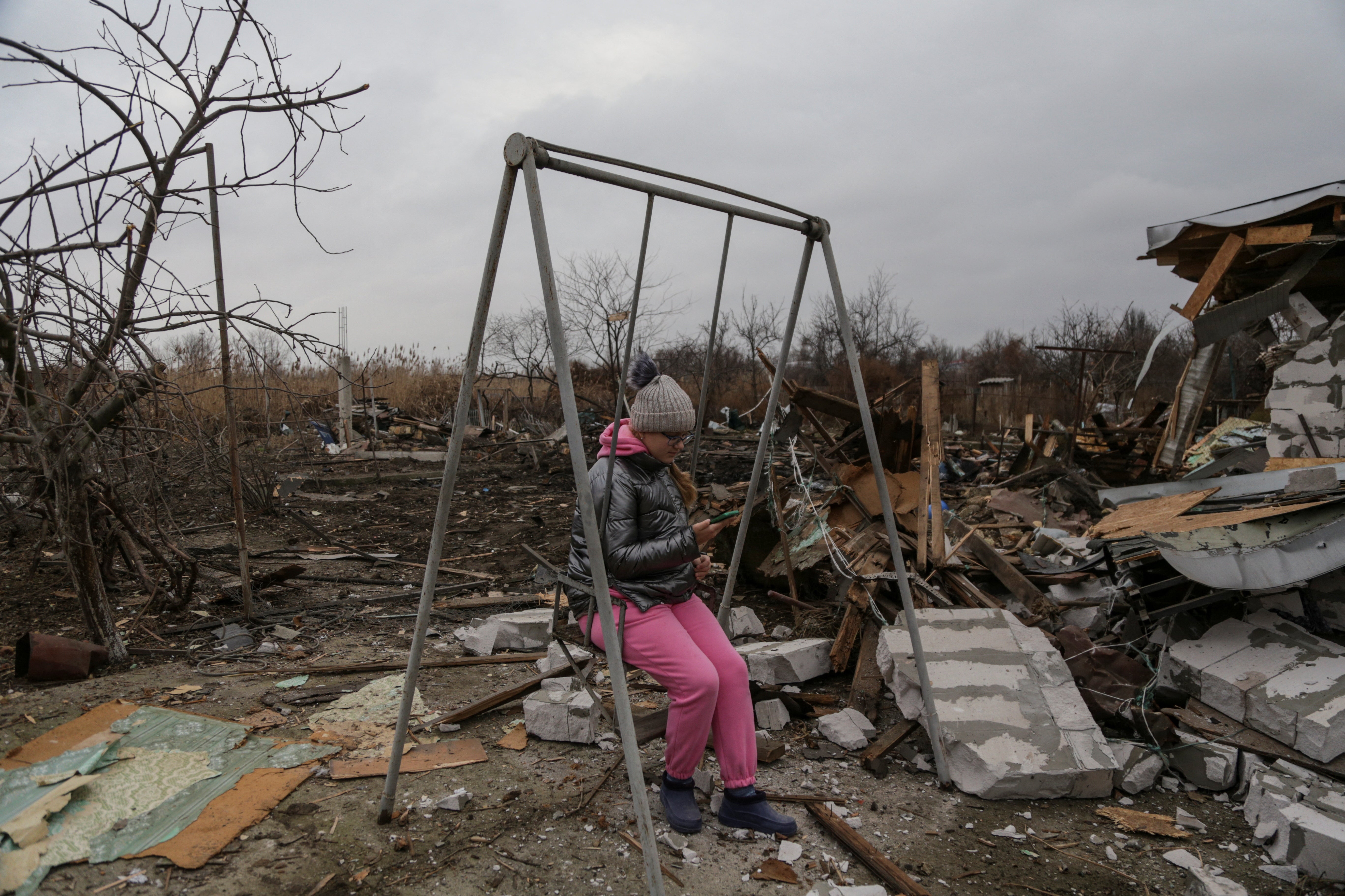 

<p>A girl sits on a swing at a compound of residential houses heavily damaged by Russian drone strikes </p>
<p>” height=”3648″ width=”5472″ layout=”responsive” i-amphtml-layout=”responsive”><i-amphtml-sizer slot=