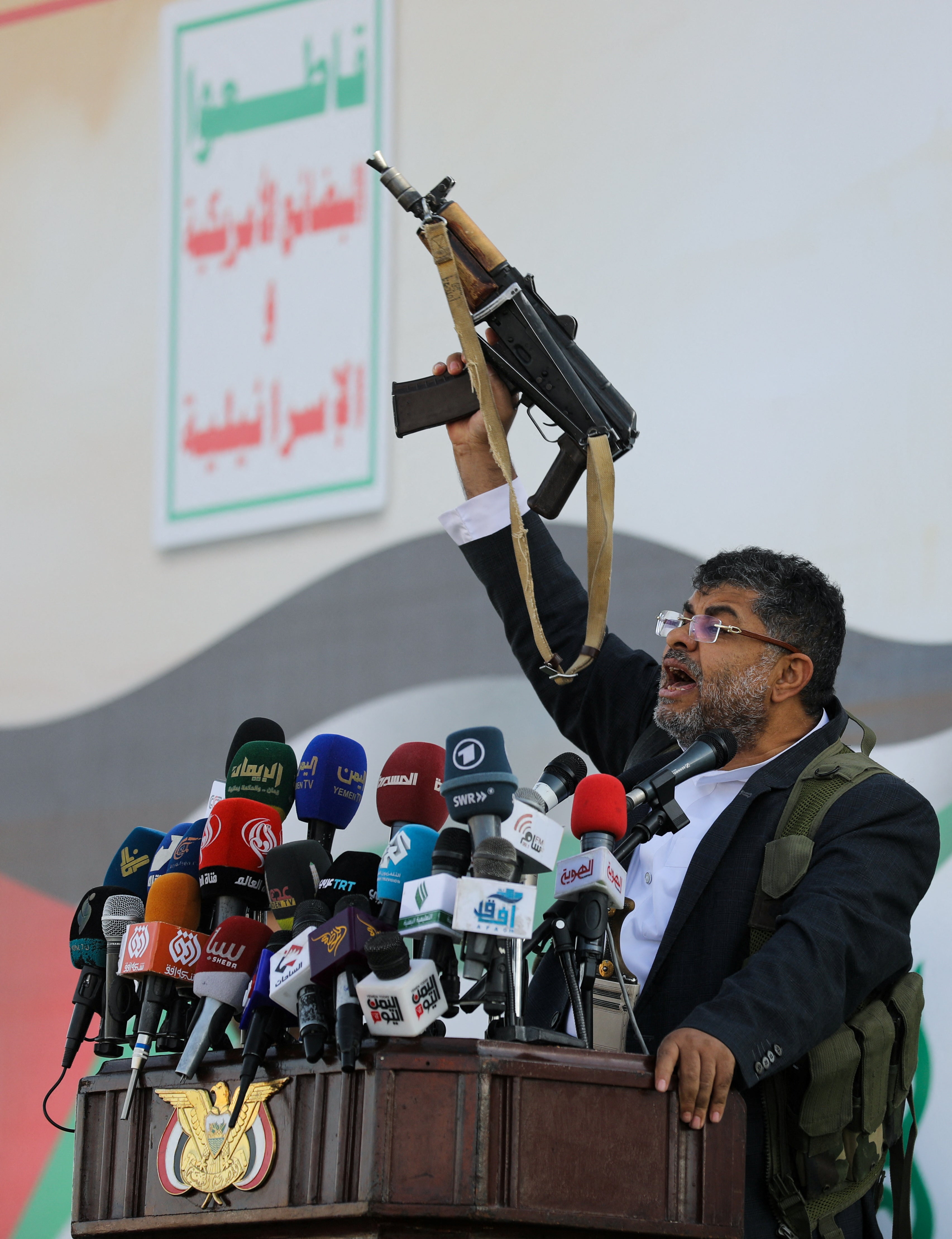 

<p>Mohammed Ali al-Houthi, a member of the Houthi supreme political council, speaks while holding a gun, as supporters of the Houthi movement rally to denounce air strikes launched by the US and Britain on Houthi targets, in Sanaa, Yemen 12 January 2024</p>
<p>” height=”4438″ width=”3410″ layout=”responsive” i-amphtml-layout=”responsive”><i-amphtml-sizer slot=