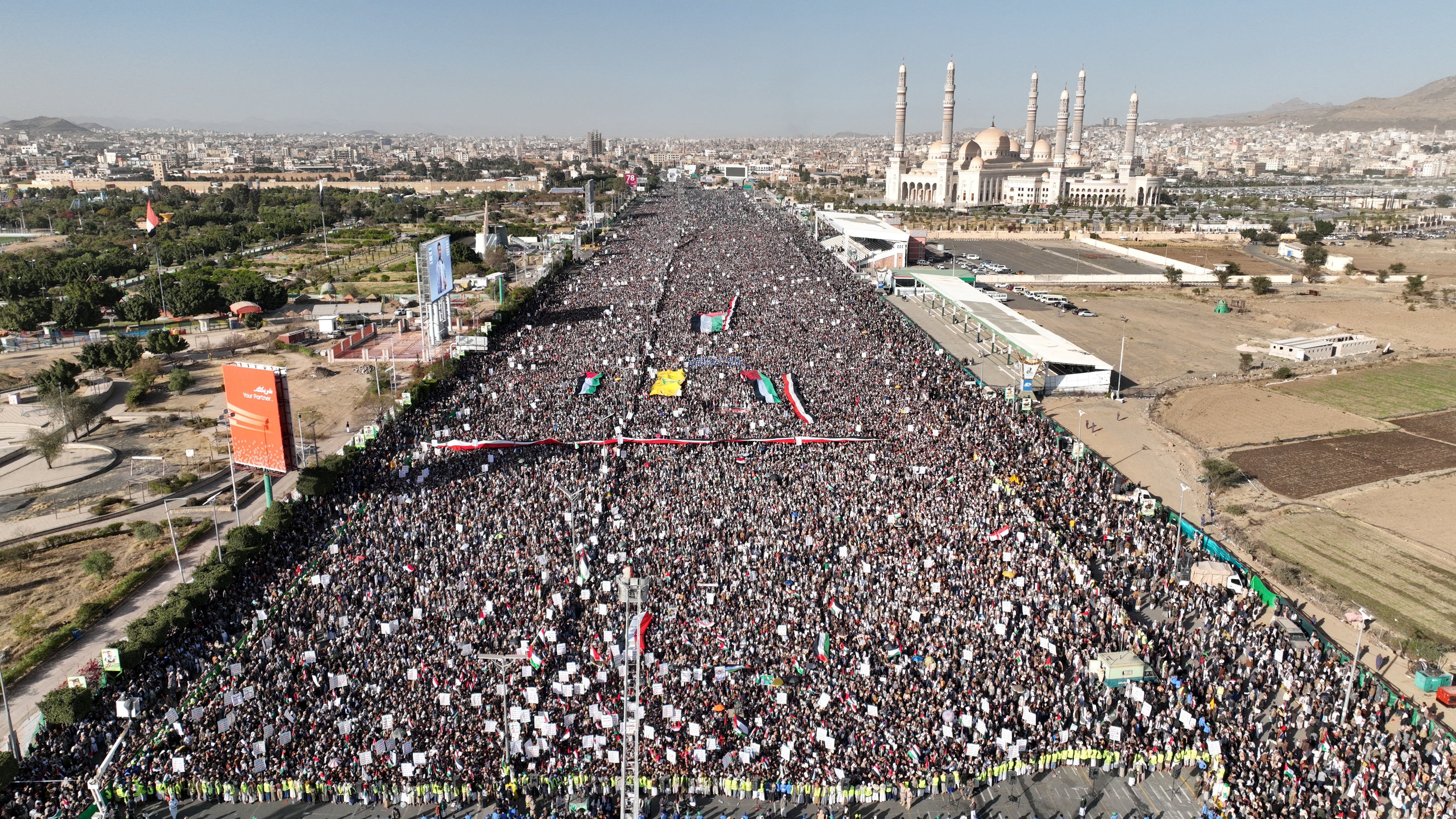 

<p>A drone view as Houthi movement supporters rally to denounce air strikes launched by the US and Britain on Houthi targets, in Sanaa, Yemen, 12 January 2024</p>
<p>” height=”2970″ width=”5280″ layout=”responsive” i-amphtml-layout=”responsive”><i-amphtml-sizer slot=