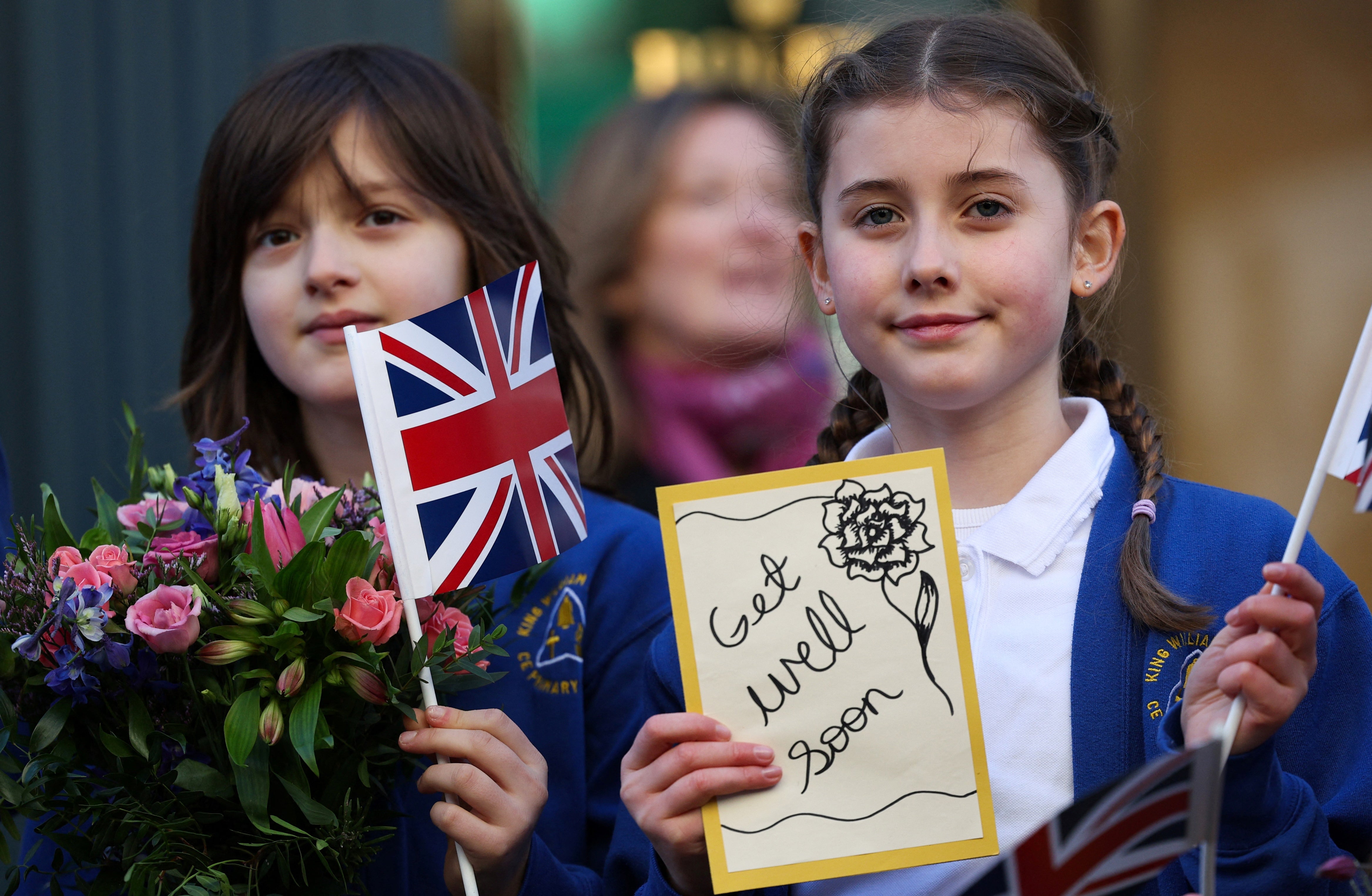 

<p>A group of young girls hold get well cards for Britain’s King Charles III as they wait to greet Britain’s Queen Camilla during her visit to Deacon & Son Jewellers in Swindon </p>
<p>” height=”3049″ width=”4669″ layout=”responsive” i-amphtml-layout=”responsive”><i-amphtml-sizer slot=