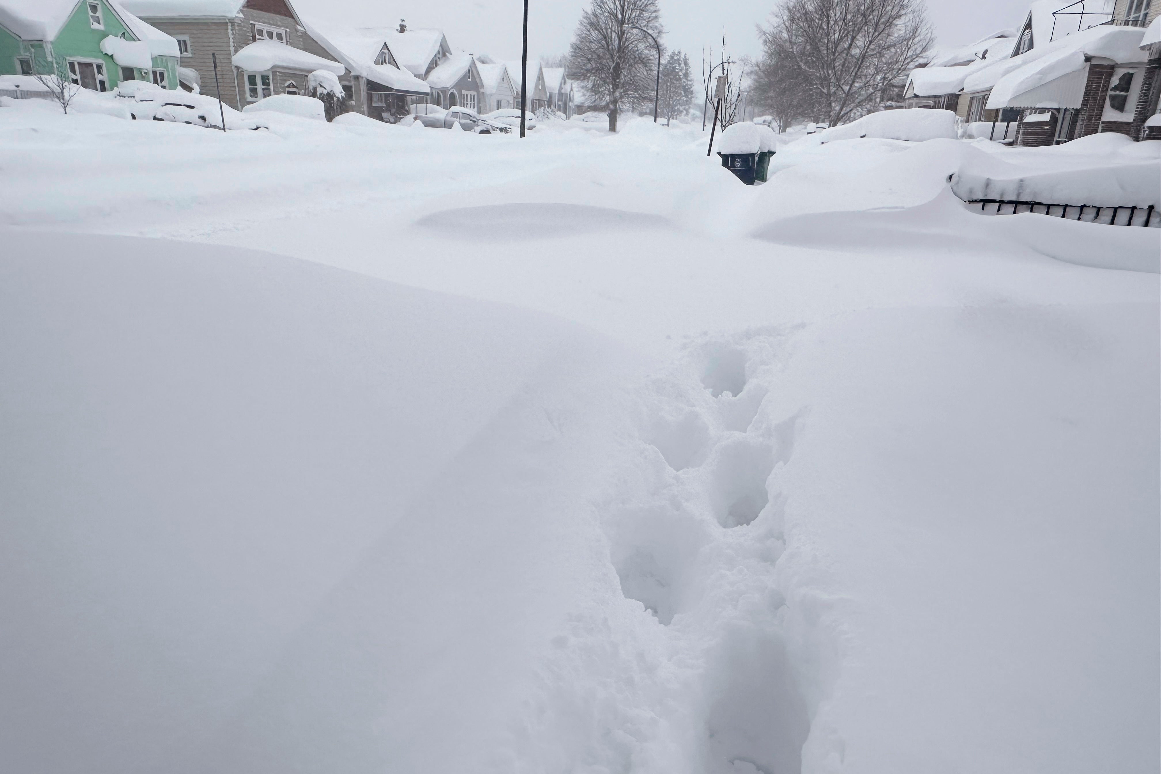 

<p>Footprints appear on a residential street after at least 18 inches of new snow fell overnight on Tuesday in Buffalo</p>
<p>” height=”2688″ width=”4032″ layout=”responsive” i-amphtml-layout=”responsive”><i-amphtml-sizer slot=