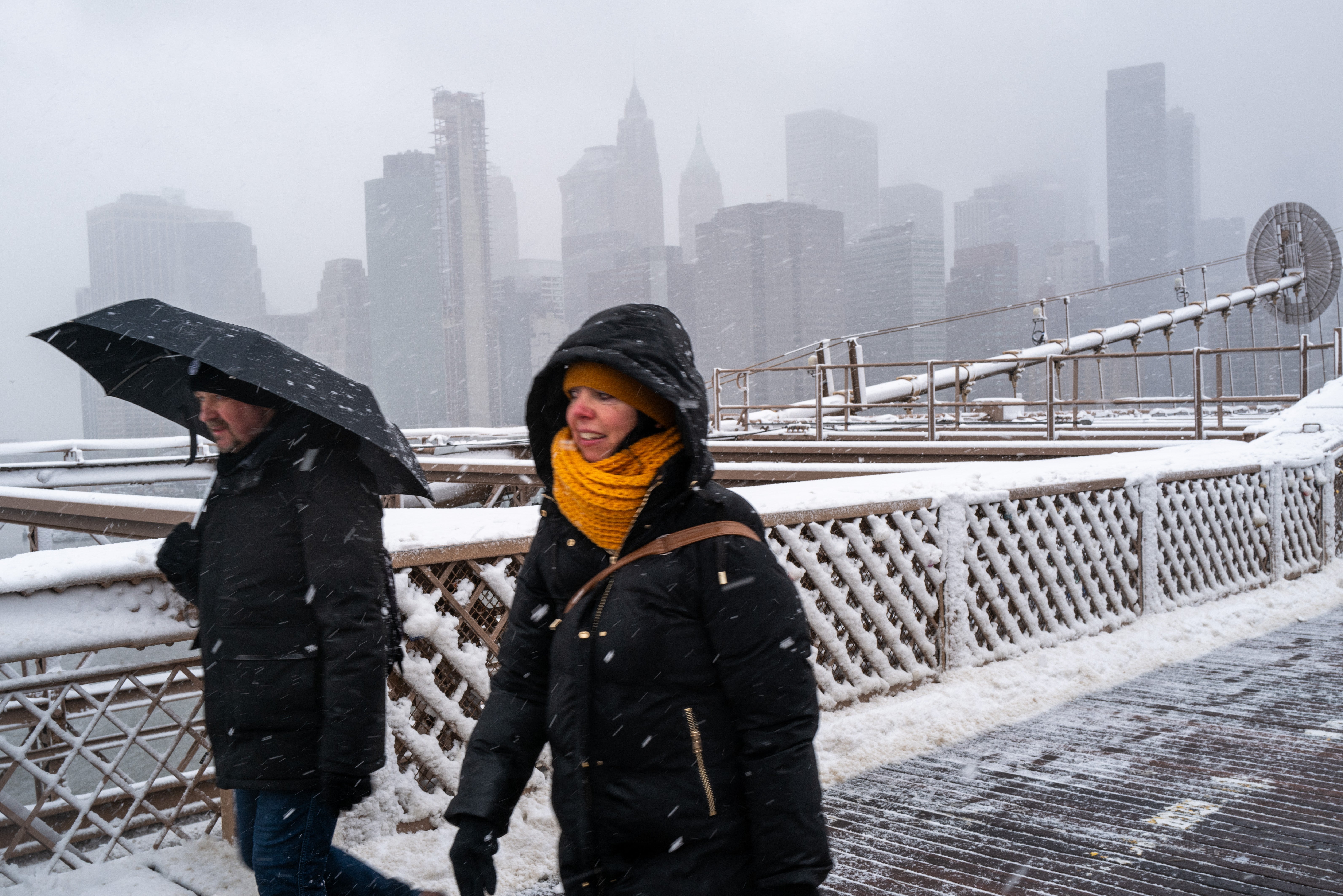 

<p>eople walk across the Brooklyn Bridge in the blowing snow in Manhattan as a large winter storm makes its way across the area on February 13, 2024 in New York City</p>
<p>” height=”4250″ width=”6369″ layout=”responsive” i-amphtml-layout=”responsive”><i-amphtml-sizer slot=