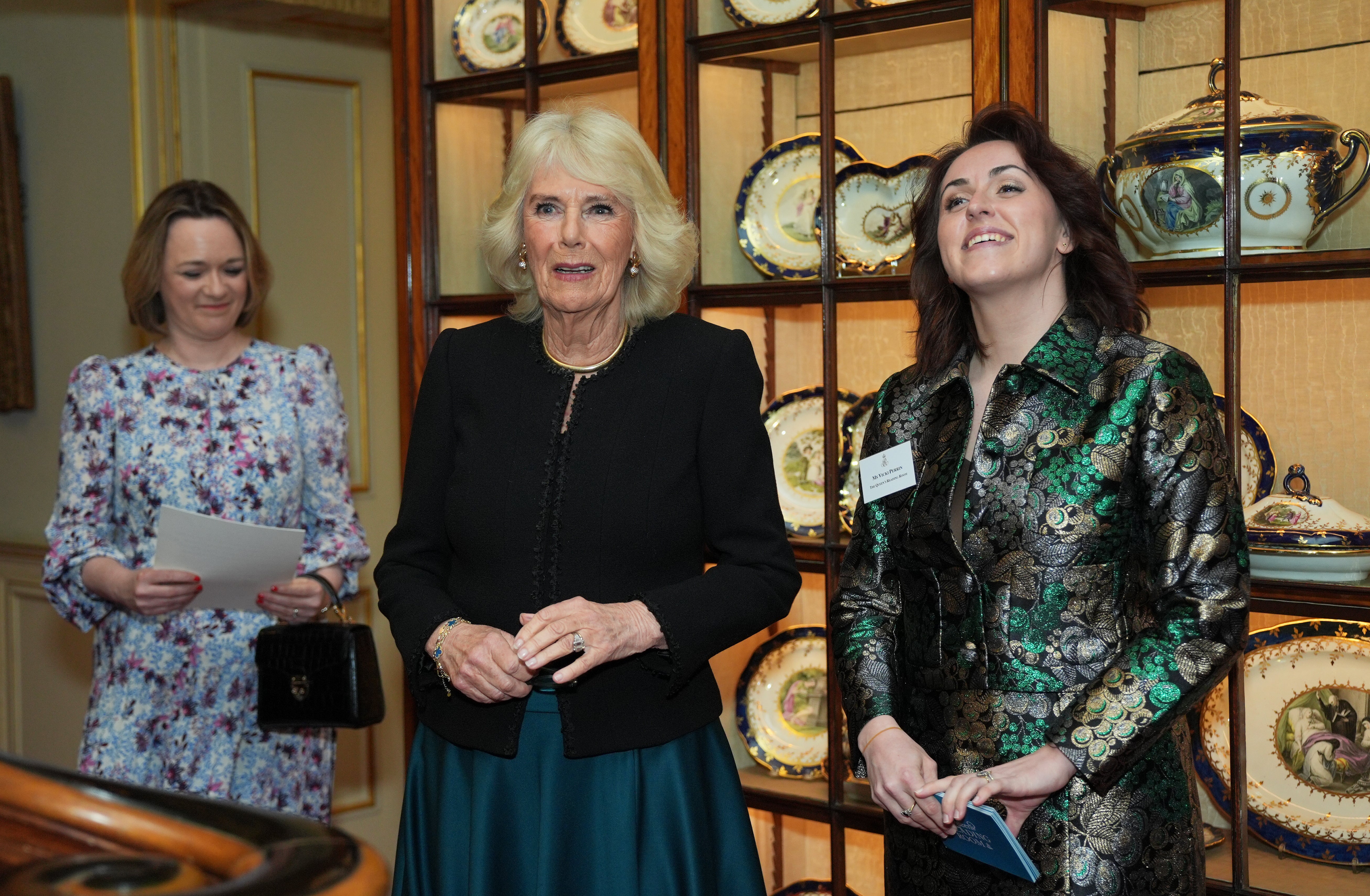 

<p>Queen Camilla (centre) and Director, The Queen’s Reading Room, Vicki Perrin (right) during a reception to mark the findings of a new research study commissioned by The Queen’s Reading Room charity, at Clarence House in London</p>
<p>” height=”3420″ width=”5228″ layout=”responsive” i-amphtml-layout=”responsive”><i-amphtml-sizer slot=