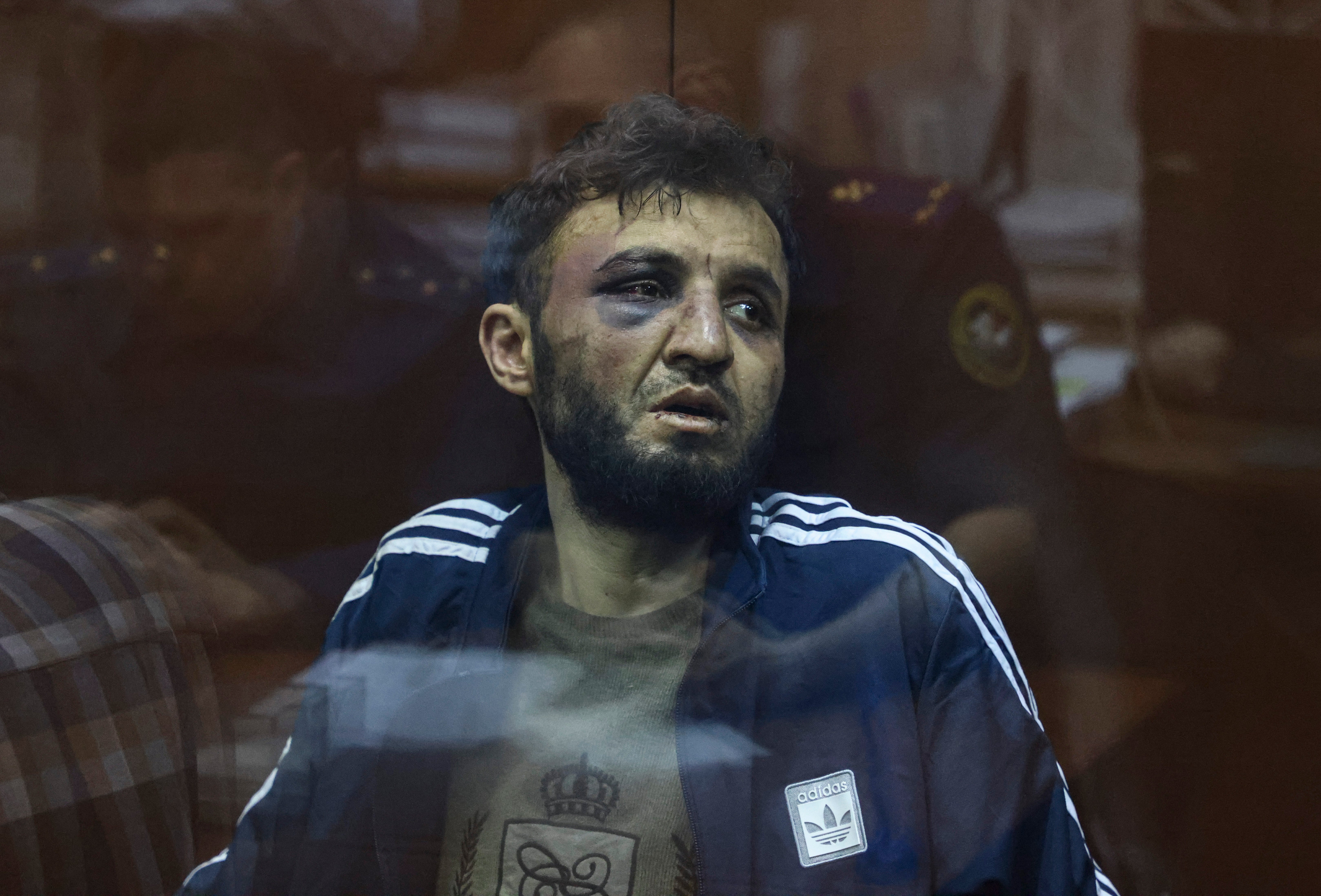 

<p>Dalerdzhon Mirzoyev, a suspect in the shooting attack at the Crocus City Hall concert venue, sits behind a glass wall of an enclosure for defendants at the Basmanny district court in Moscow </p>
<p>” height=”4394″ width=”6480″ layout=”responsive” i-amphtml-layout=”responsive”><i-amphtml-sizer slot=