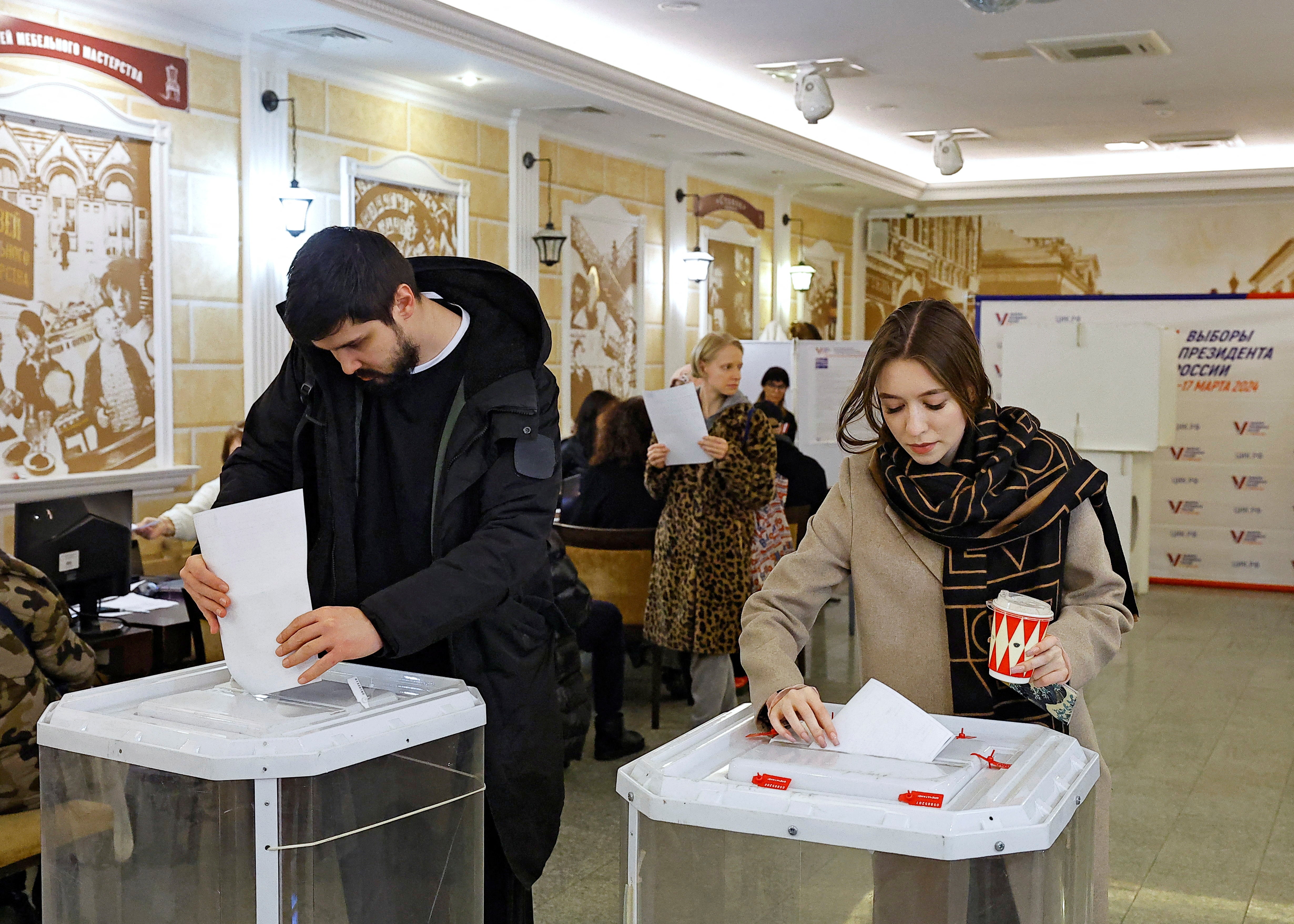

<p>Two voters cast their ballots, which include Putin and three Kremlin-vetted candidates, on Sunday</p>
<p>” height=”3515″ width=”4921″ layout=”responsive” i-amphtml-layout=”responsive”><i-amphtml-sizer slot=