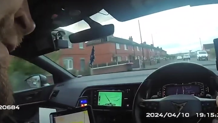 Driver reverses wrong way at 60mph before he is caught by police officer - on a bike
