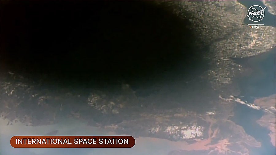 The Moon’s shadow, or umbra, on Earth was visible from the space station as it orbited into the path of the solar eclipse over southeastern Canada