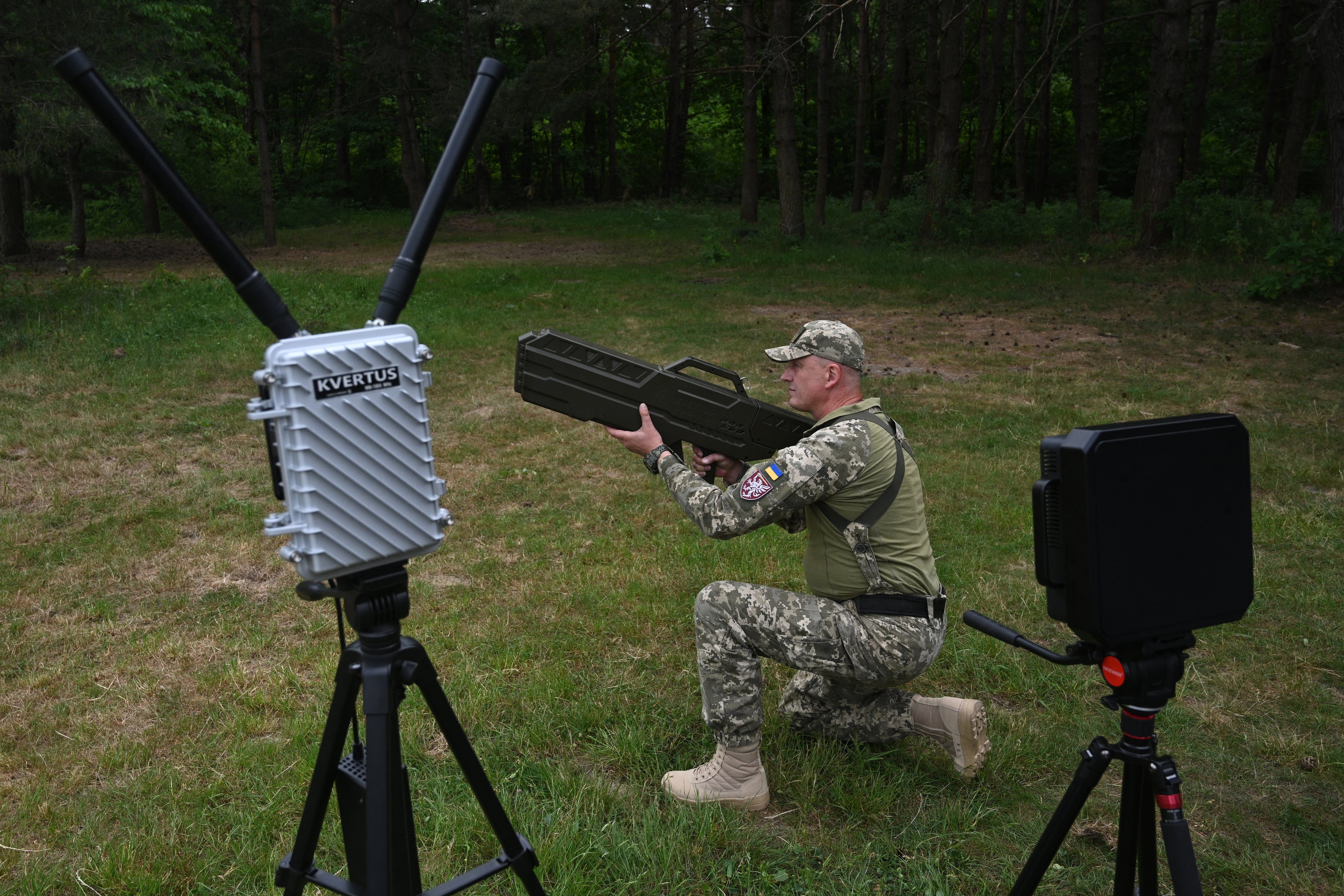 A Ukrainian serviceman tests an anti-drone gun during a presentation of radio-electronic warfare (WB) and radio-electronic intelligence (PER) systems