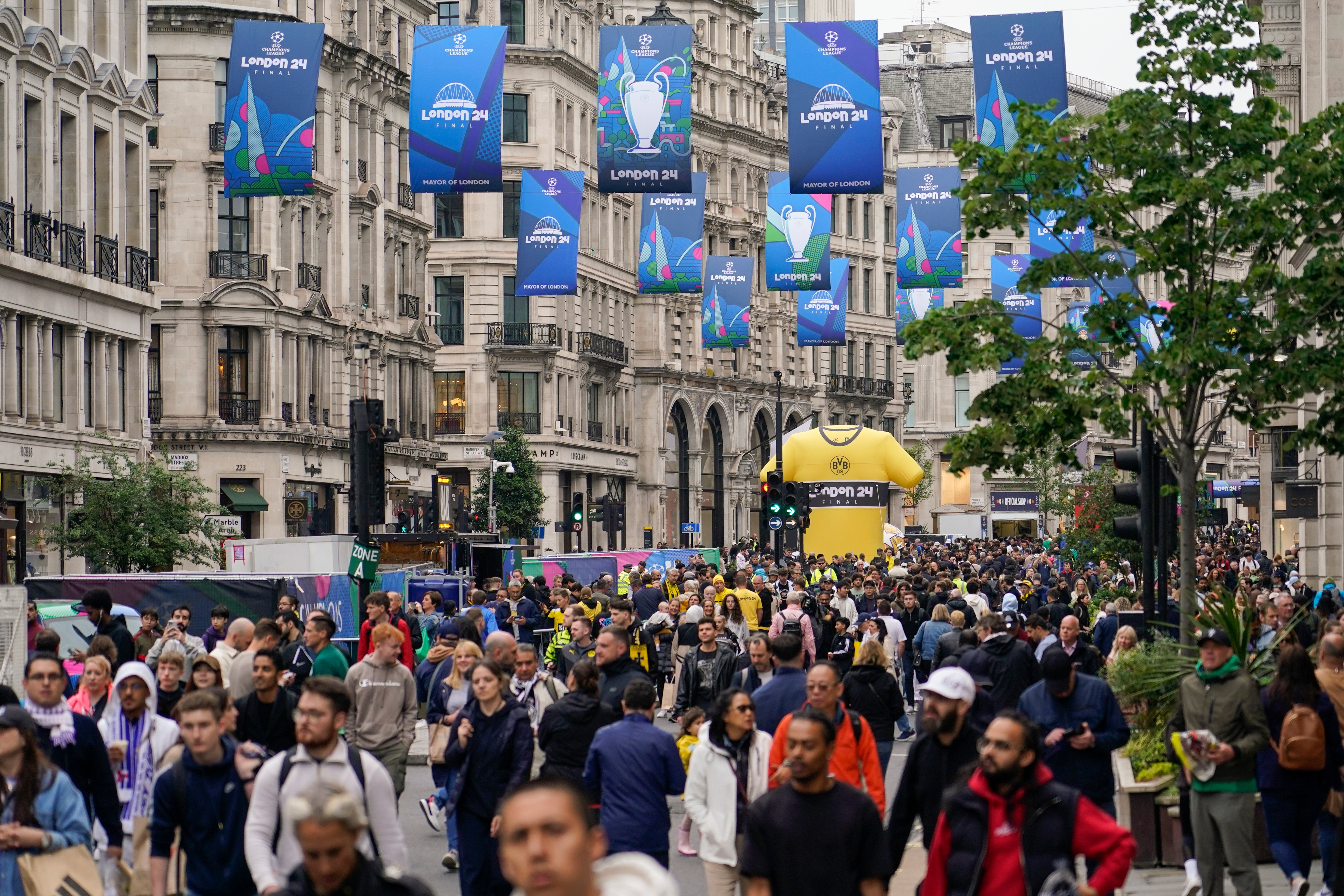Fans descend to a fan zone in Regent Street
