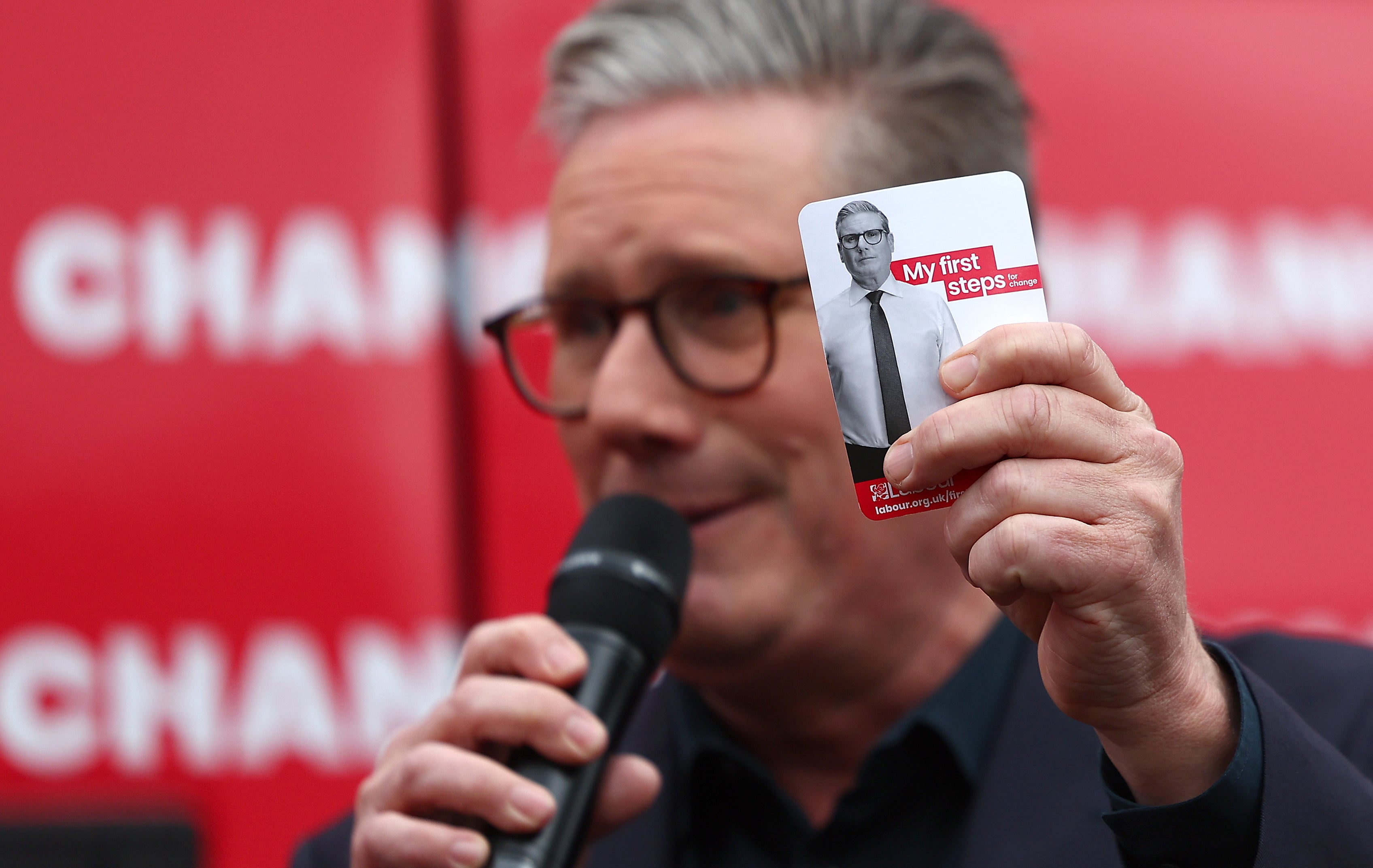 Labour Party Leader Sir Keir Starmer holds a card detailing his policy priorities at the launch of the Labour Party election campaign ‘Battle Bus’ in Uxbridge