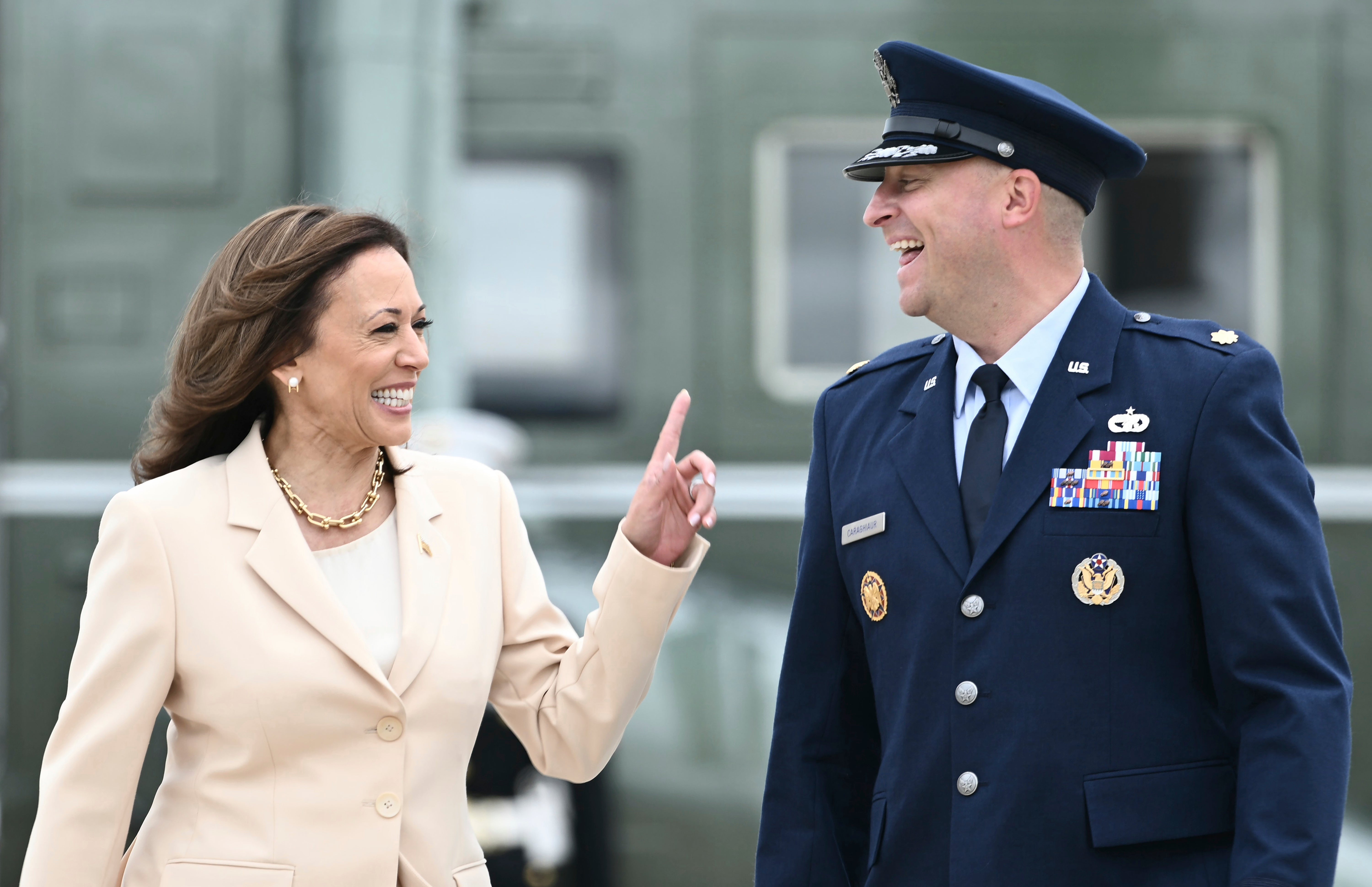 Vice President Kamala Harris arrives to board Air Force Two at Joint Base Andrews and is escorted by US Air Force, Director of Flightline Protocol, Major Philippe Caraghiaur