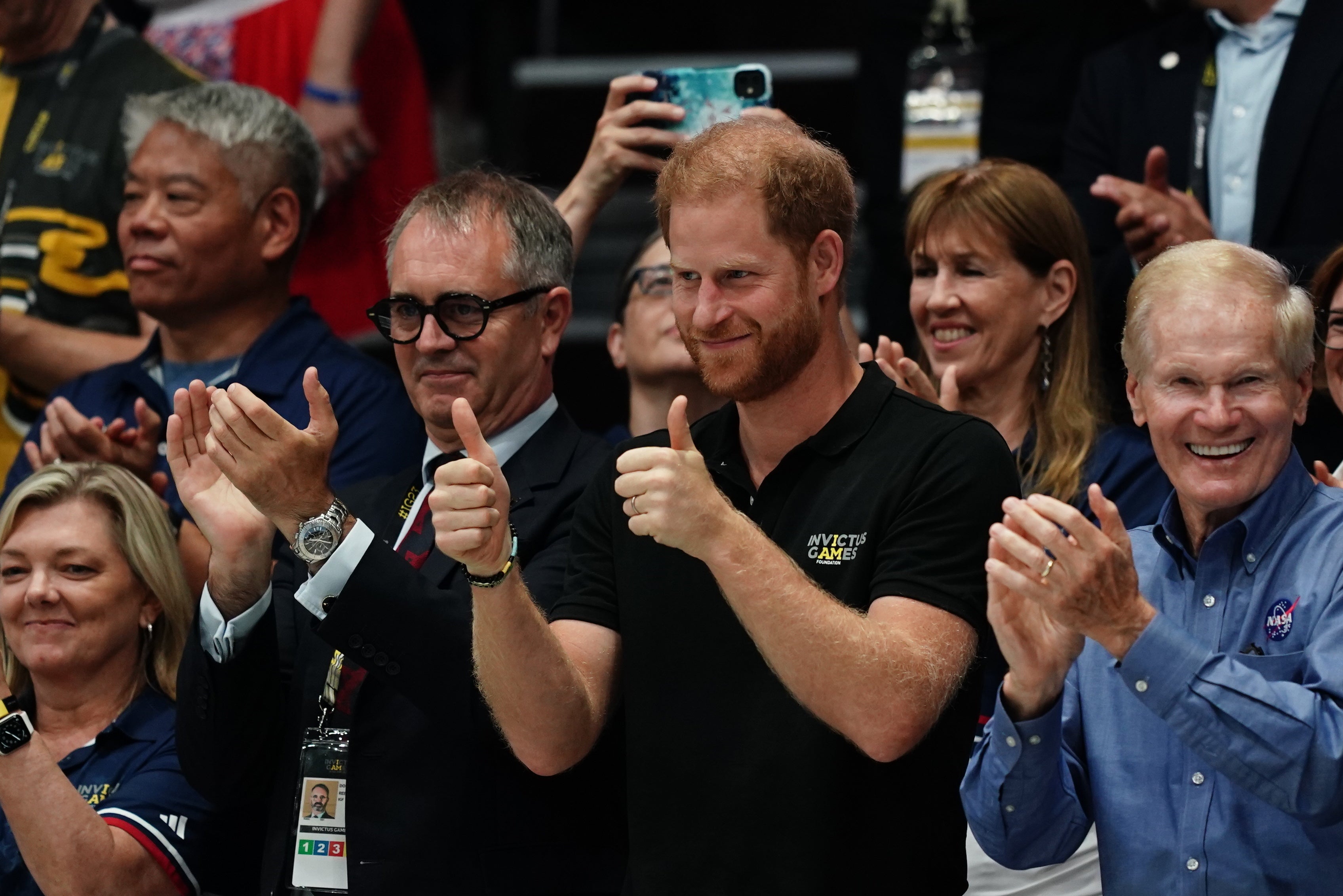 Dominic Reid and Harry watch the wheelchair rugby during the Invictus Games in Dusseldorf, Germany, last year (Jordan Pettitt/PA)