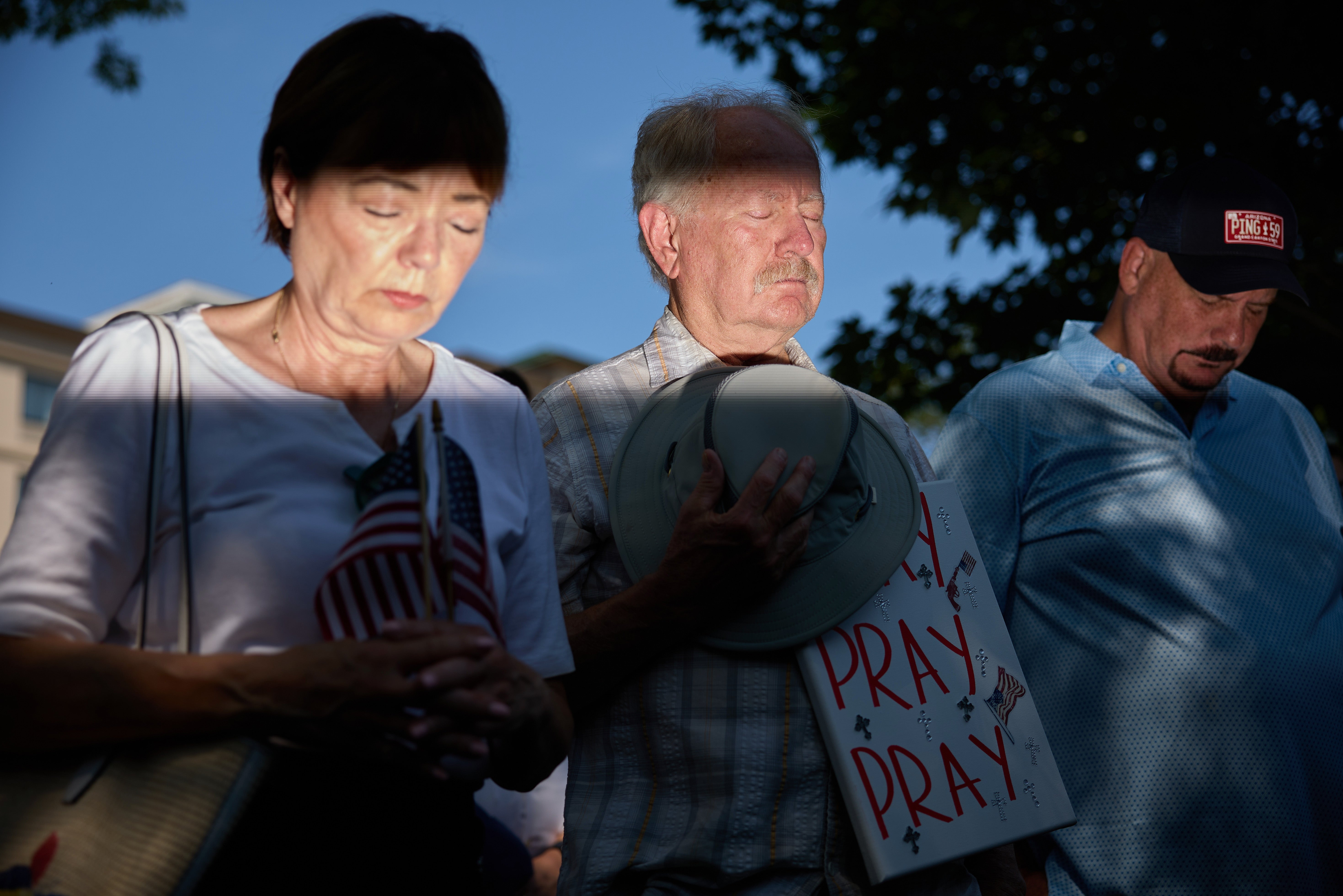 People gather to pray for Republican presidential candidate former US president Donald Trump ahead of the Republican National Convention at Zeidler Park in Milwaukee, Wisconsin USA, 14 July 2024