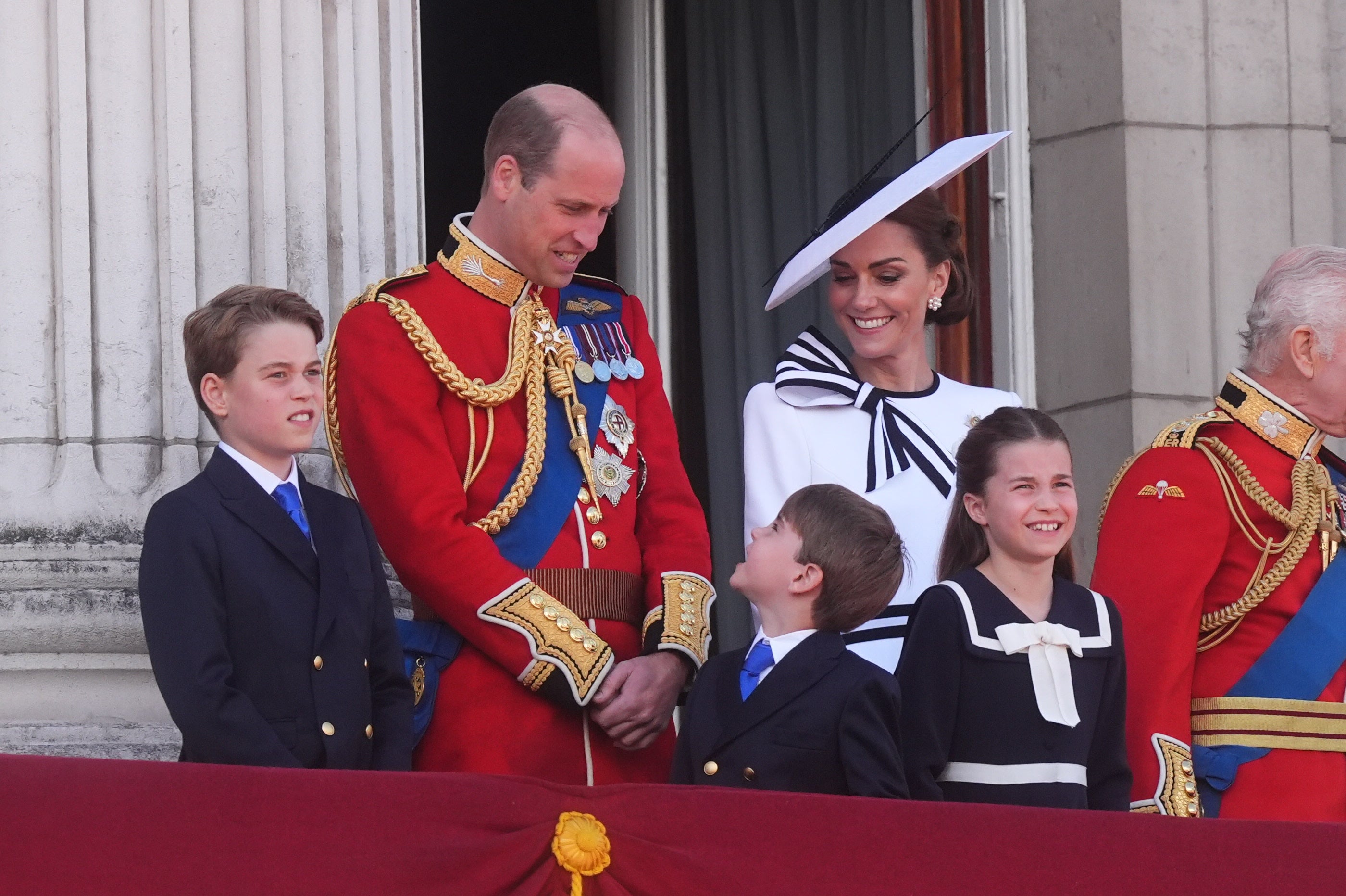 Prince William and Kate smile at their youngest son Prince Louis on her first public appearance of the year.