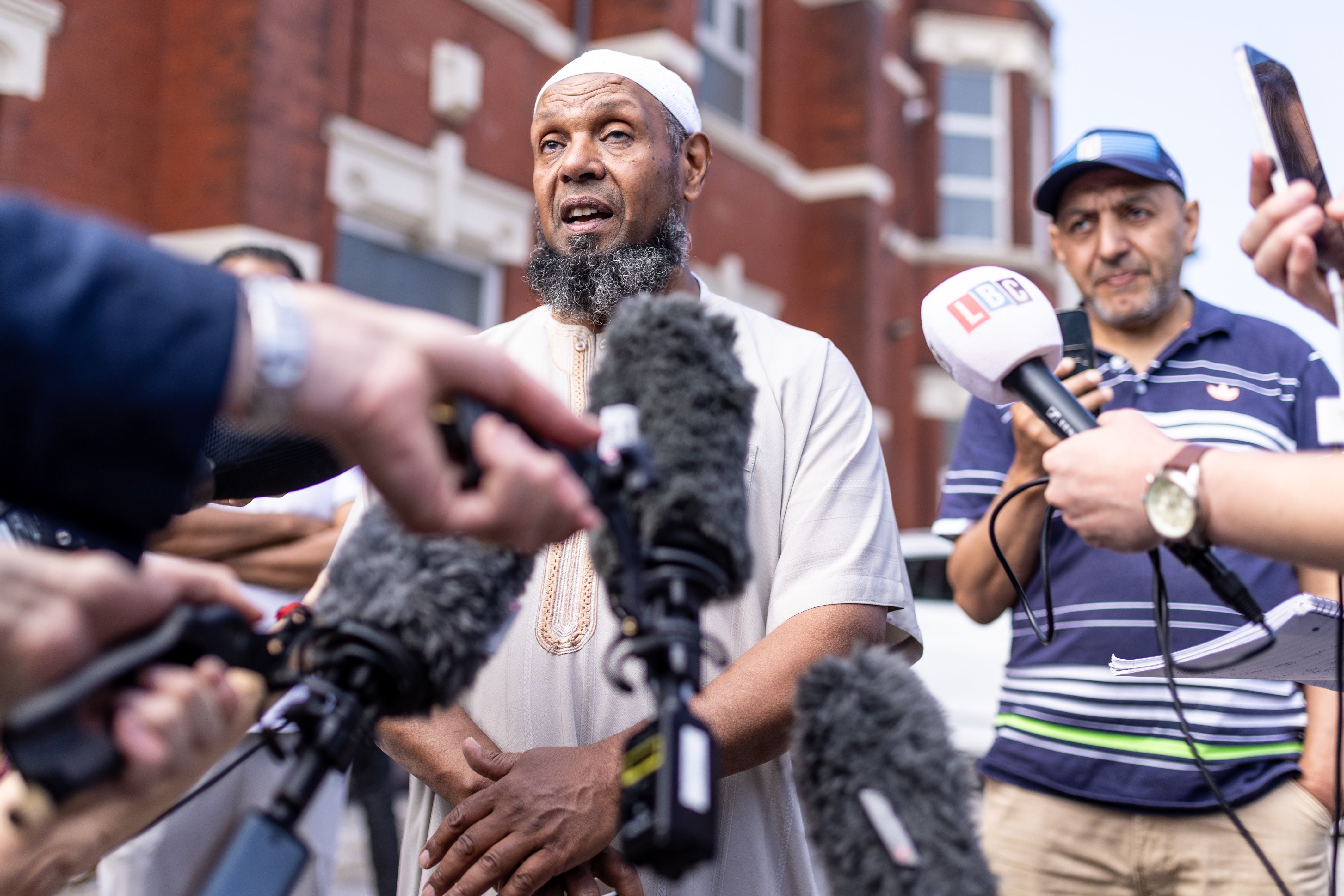 Imam Sheik Ibrahim Hussein, speaks to media outside Southport Islamic Centre Mosque on Sussex Road in Southport