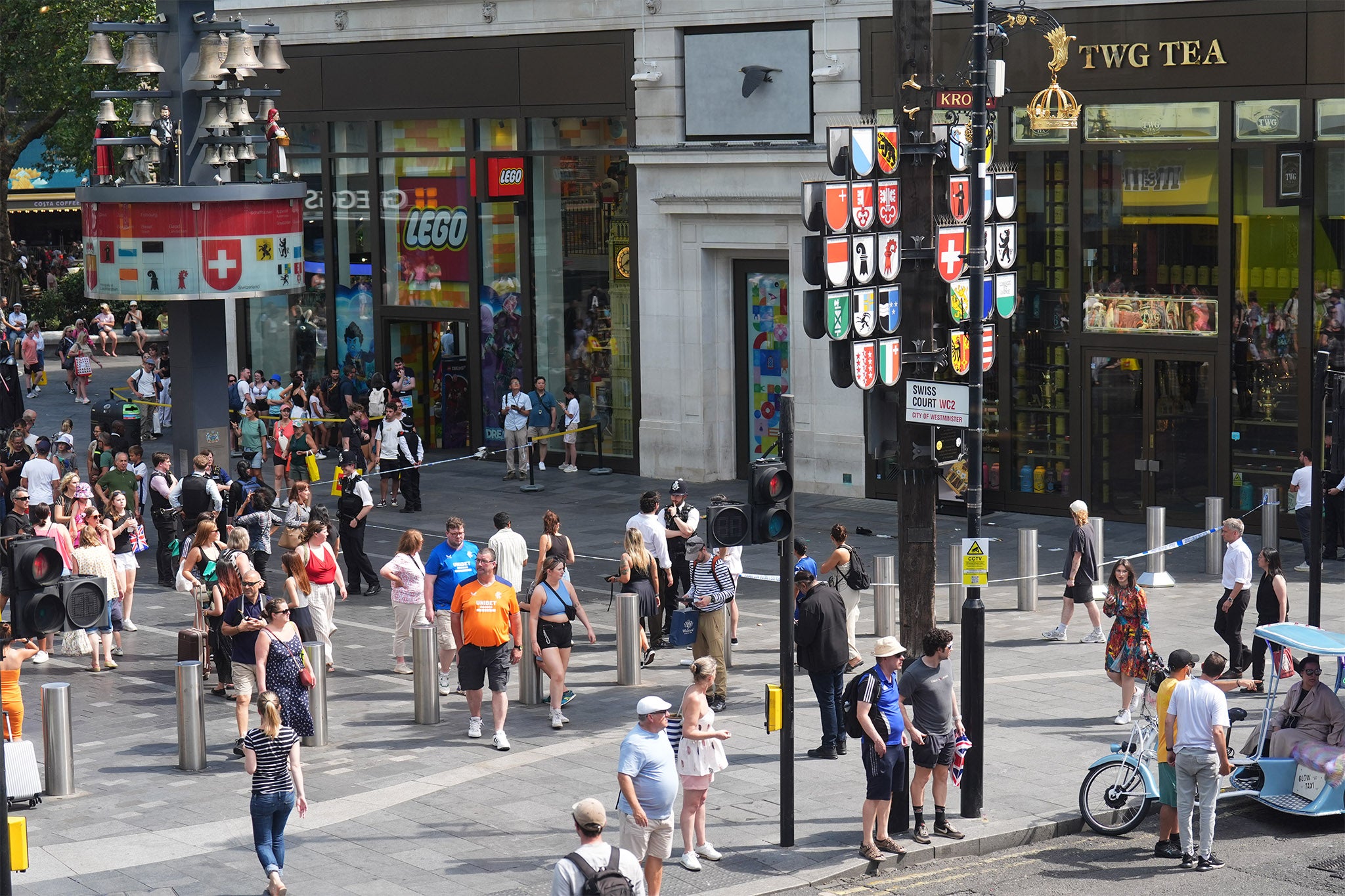 Tourists continue to mill around the area in central London