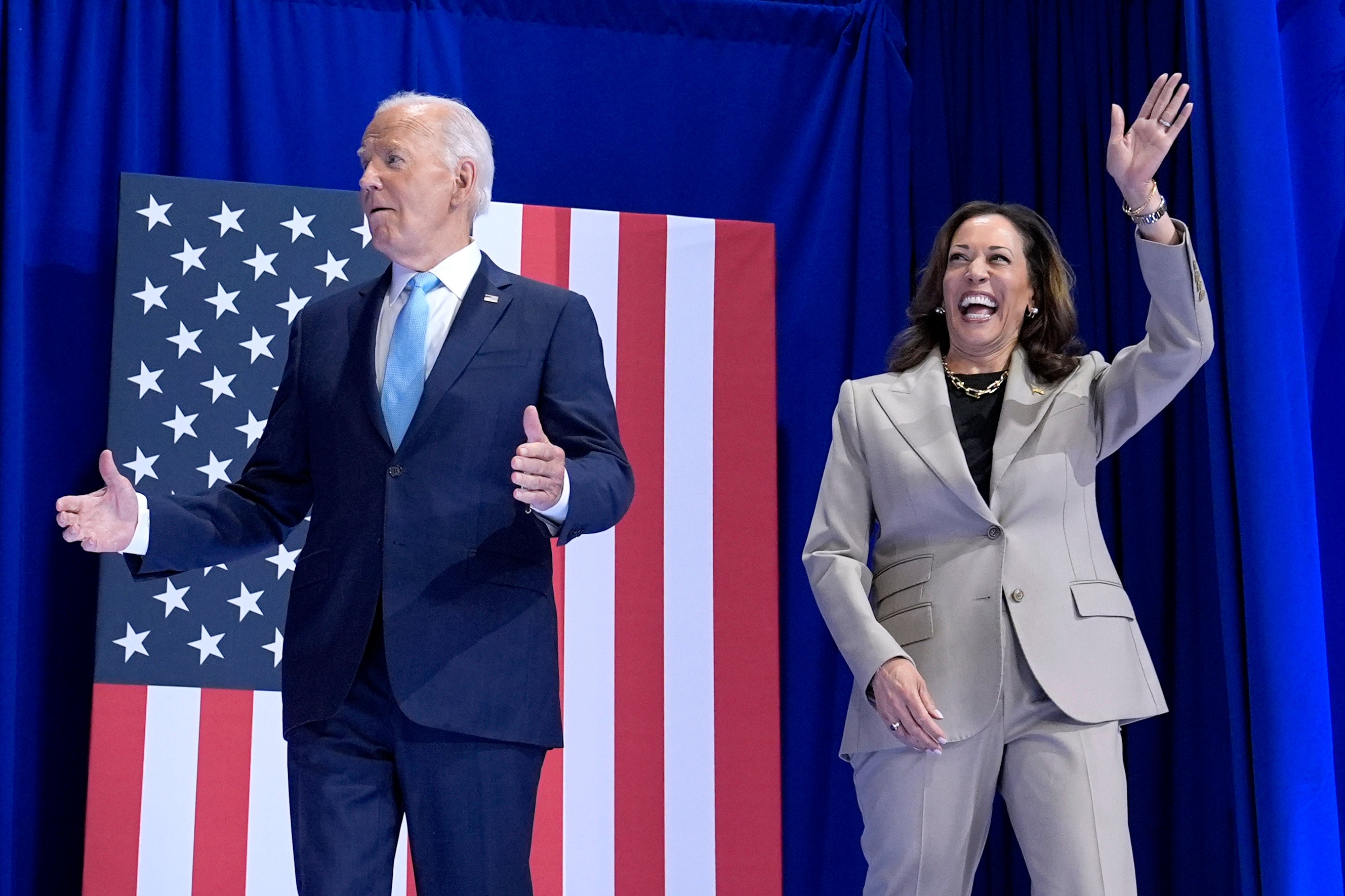 President Joe Biden, left, and Democratic presidential nominee Vice President Kamala Harris arrive to speak about the administration’s efforts to lower costs during an event at Prince George’s Community College in Largo, Maryland, on August 15, 2024