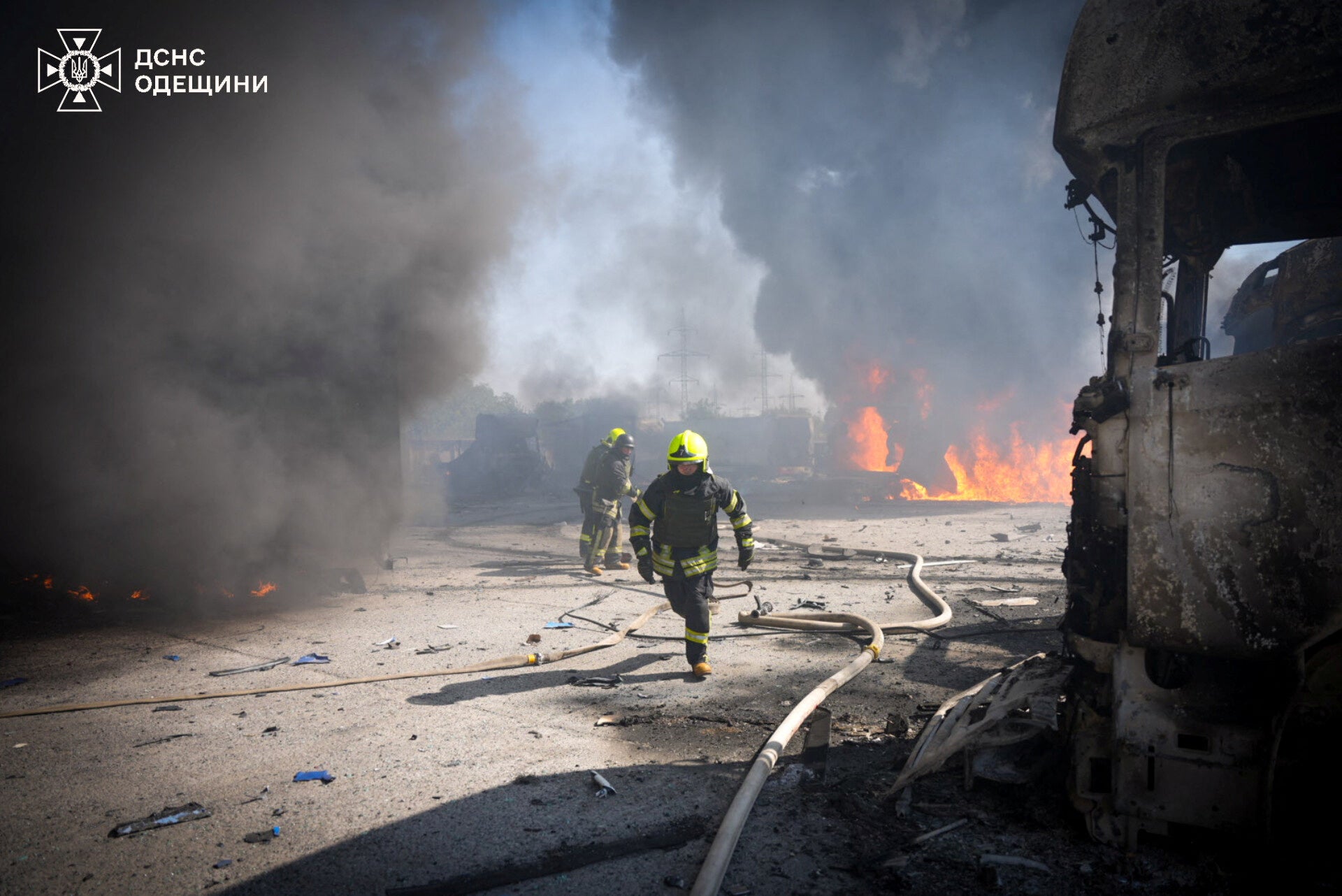 Firefighters work at the site of a Russian missile strike in the Odesa region of Ukraine on Monday