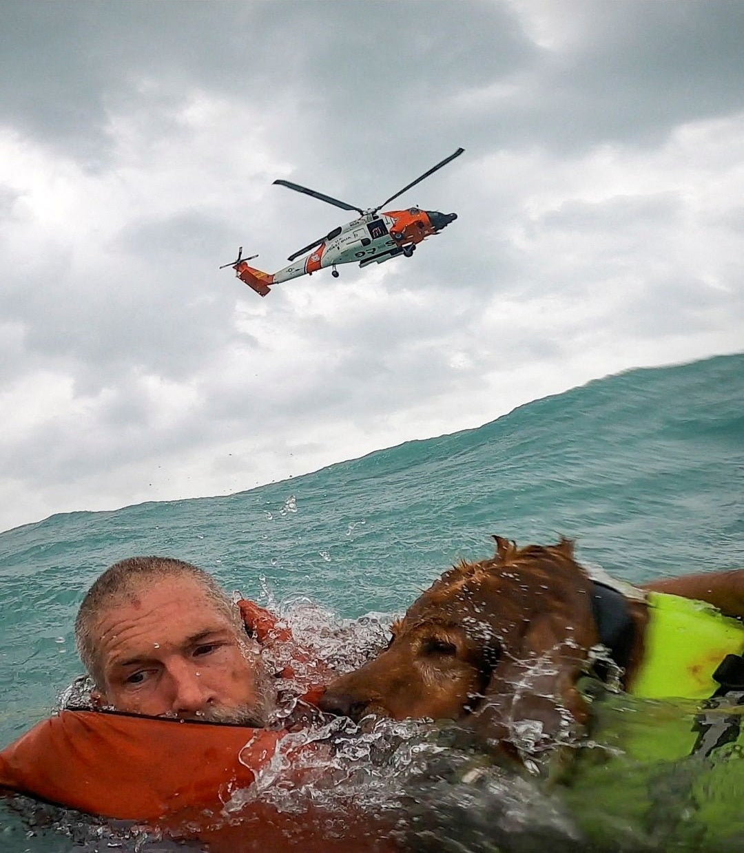 A US Coast Guard Air Station crew rescues a man and his dog during Hurricane Helene after his sailboat became disabled and started taking on water off Sanibel Island, Florida on Thursday