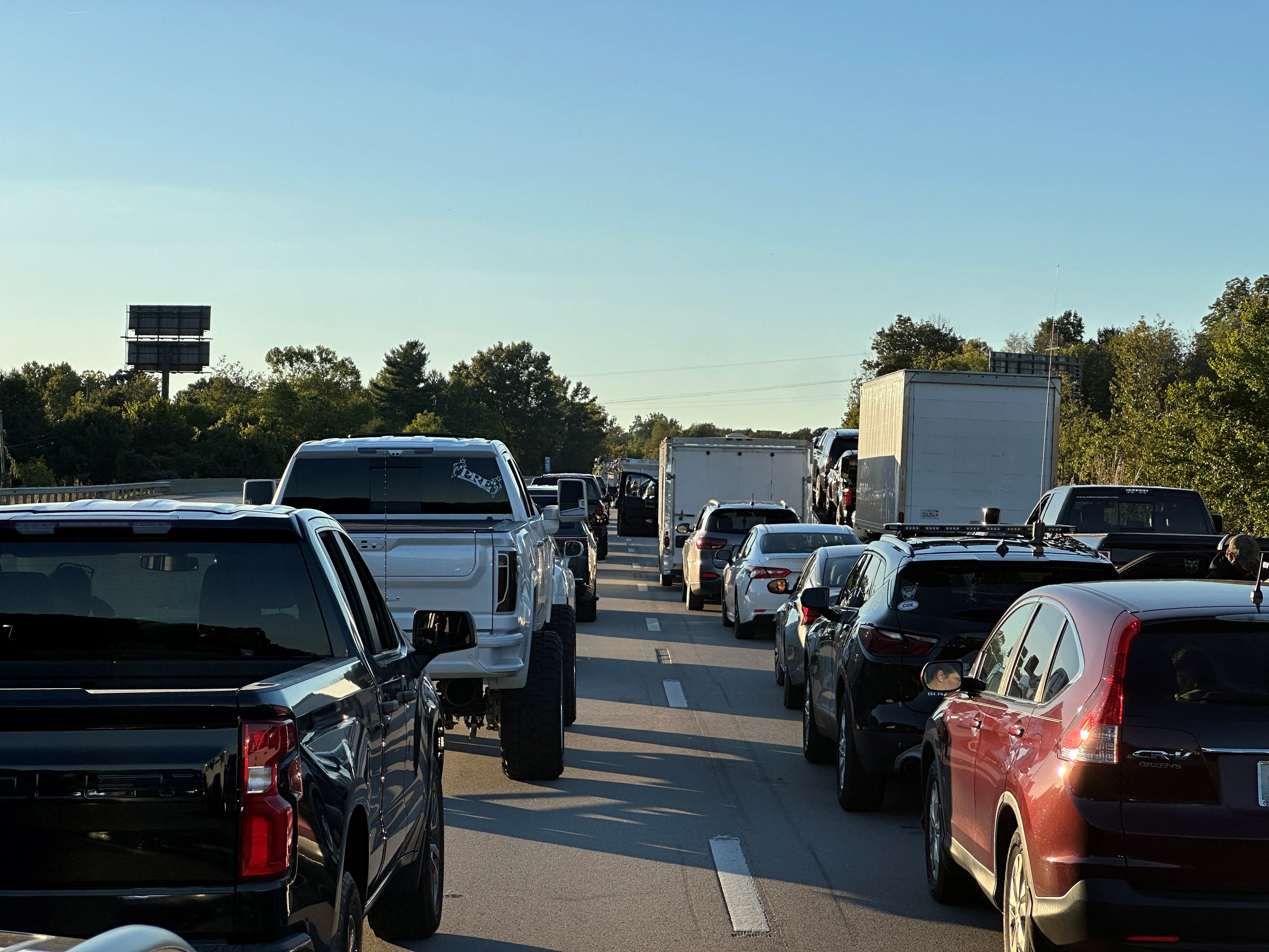 Drivers park on the lanes of the I-75 highway after reports of multiple people being shot while driving down the interstate highway, near London, Kentucky, US