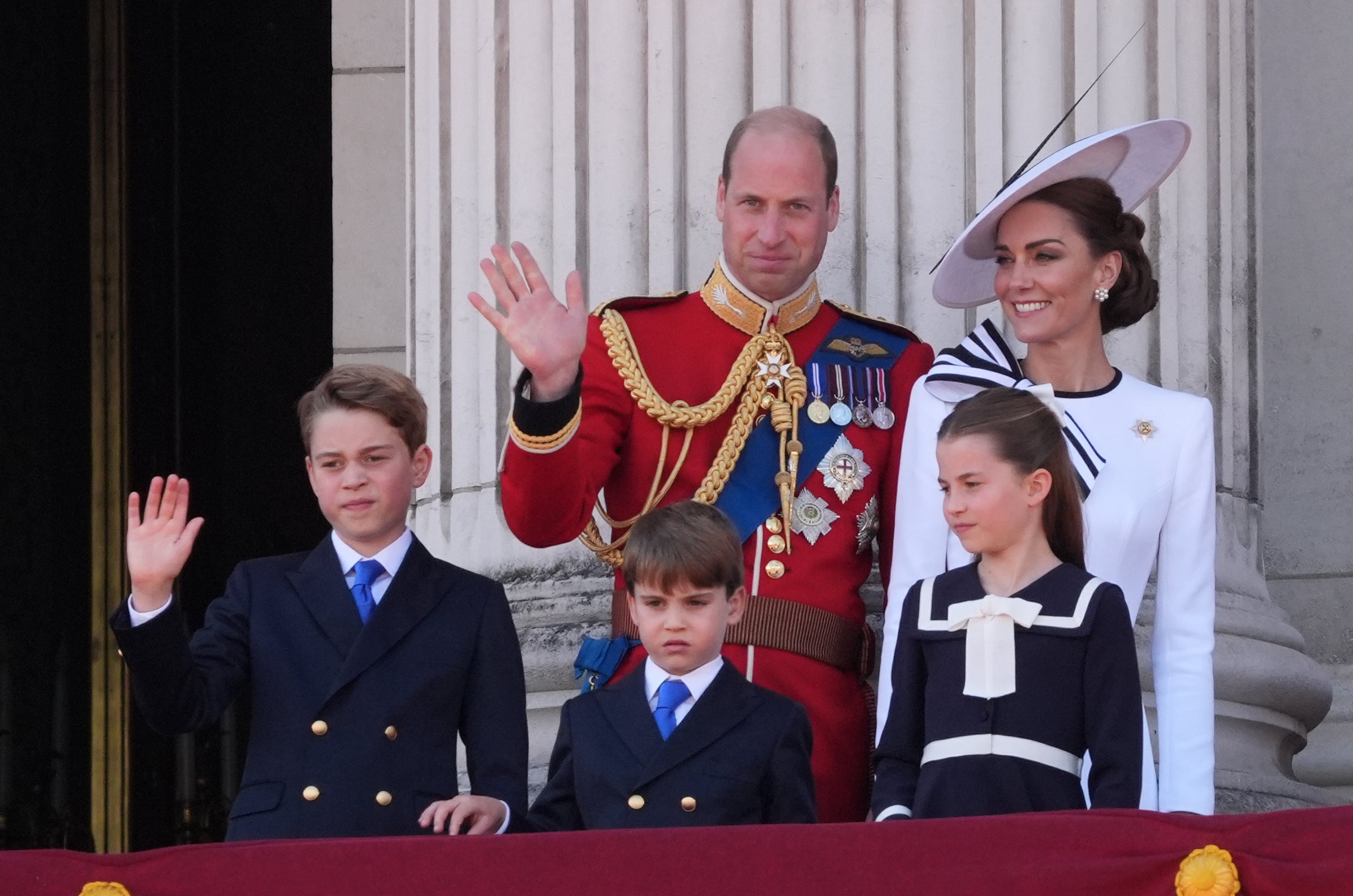 The Waleses on the balcony during the King’s official birthday celebrations (Gareth Fuller/PA)