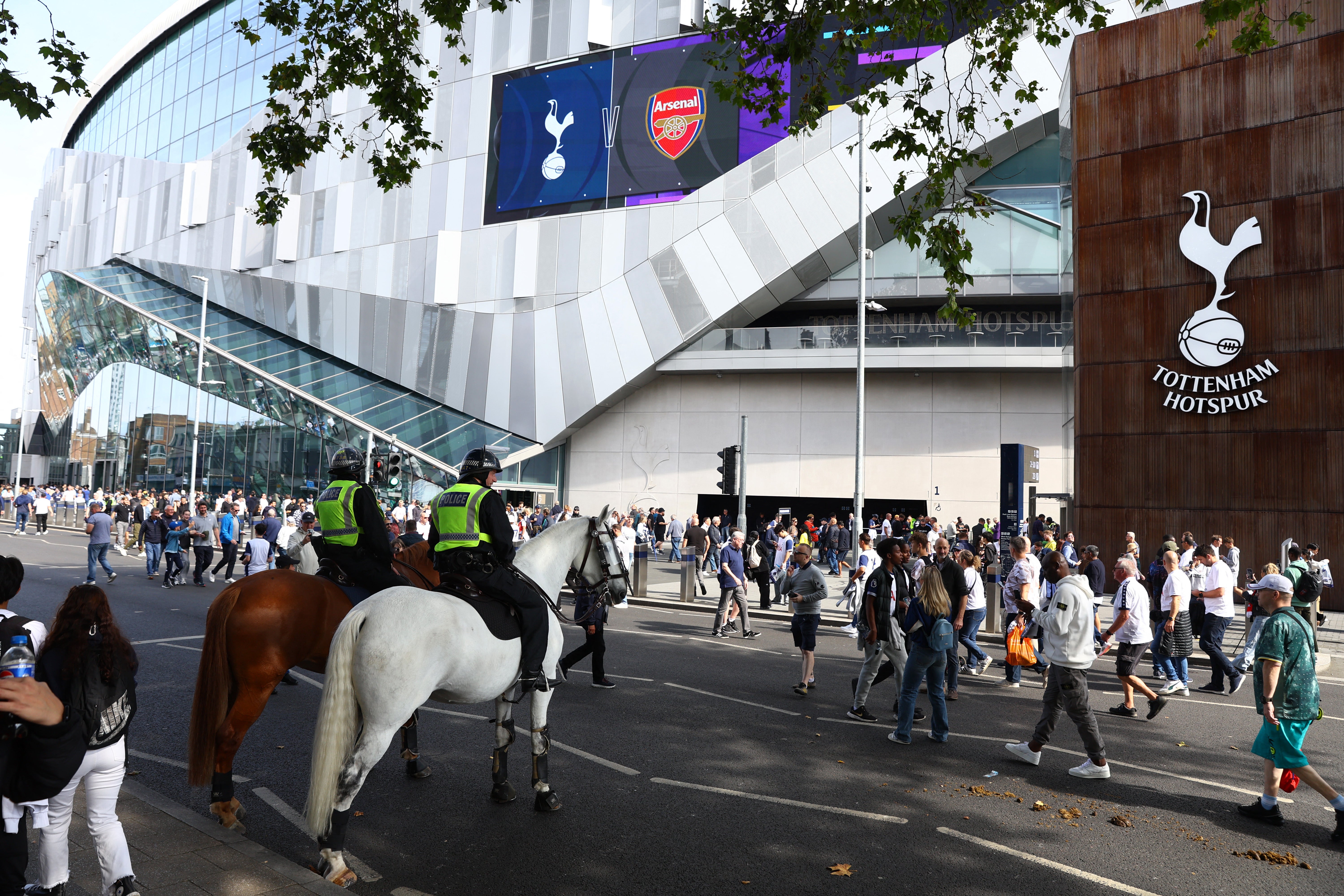 Fans gather outside the Tottenham Hotspur Stadium