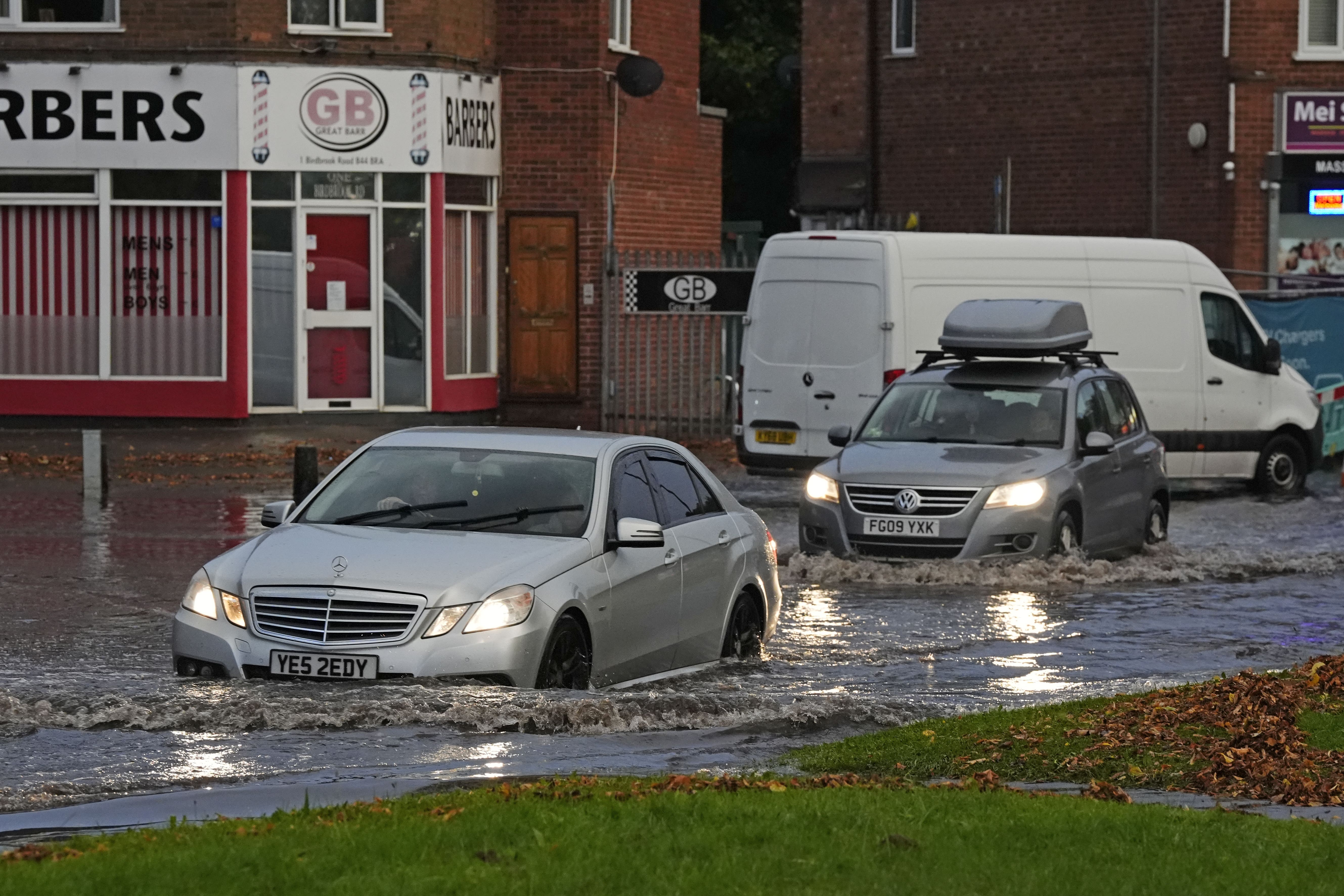 Vehicles drive through flood water in Perry Bar, Birmingham over the weekend (Nick potts/PA)