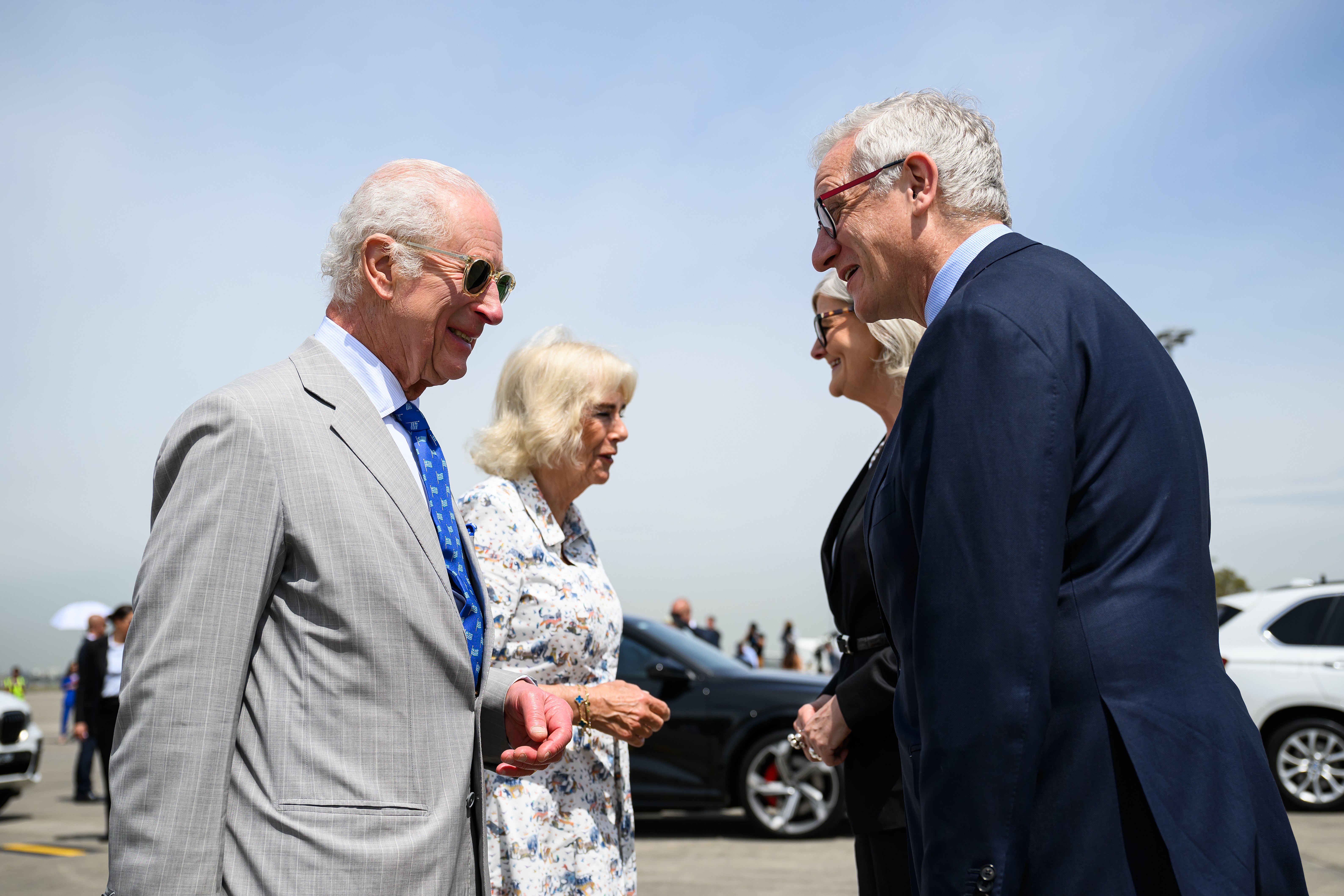 King Charles III and Queen Camilla at left are bid farewell by Australian governor-general Sam Mostyn