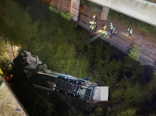 Major travel delays on M6 after lorry falls off bridge as update issued on driver