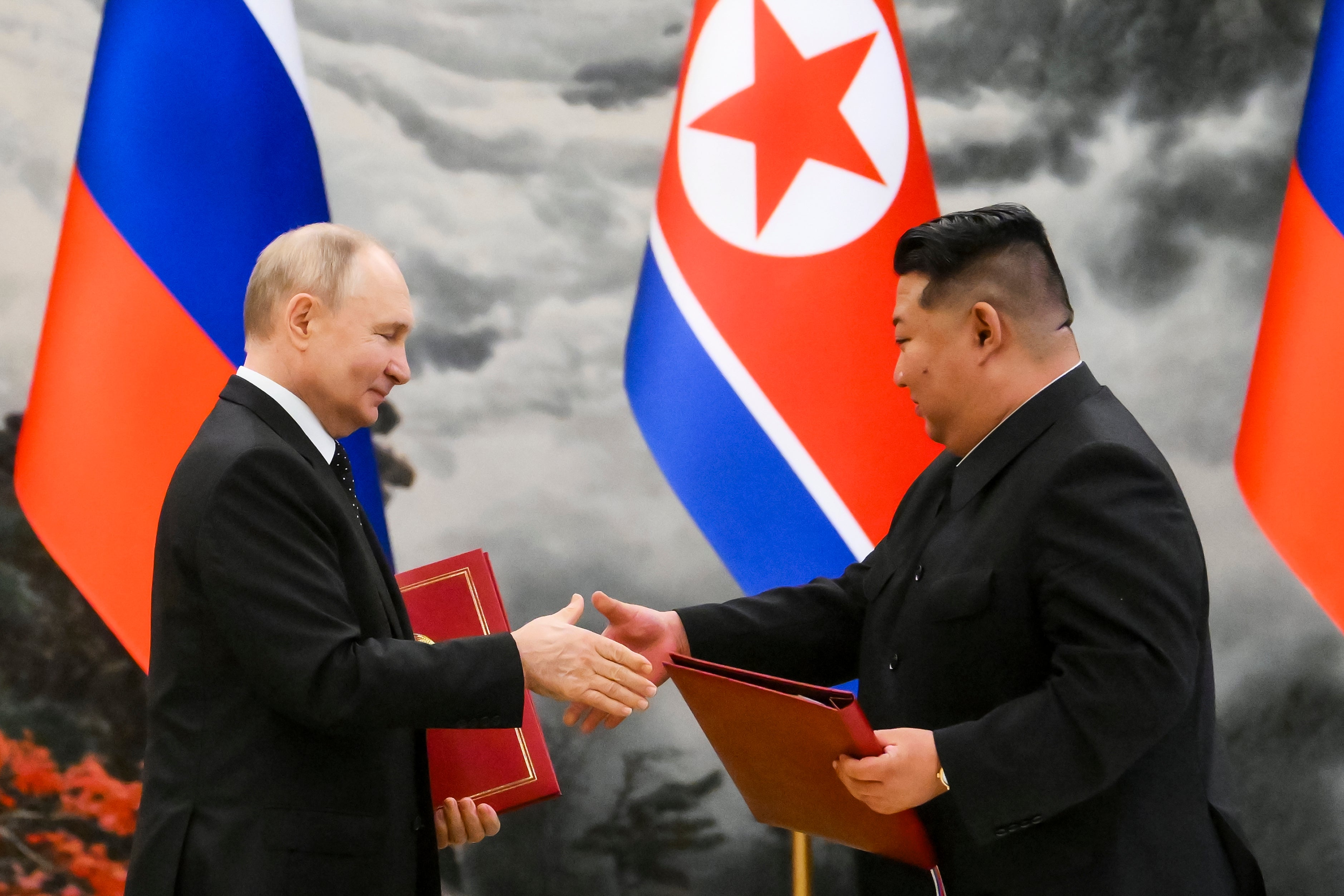 Russian President Vladimir Putin left, and North Korea’s leader Kim Jong Un pictured together in June