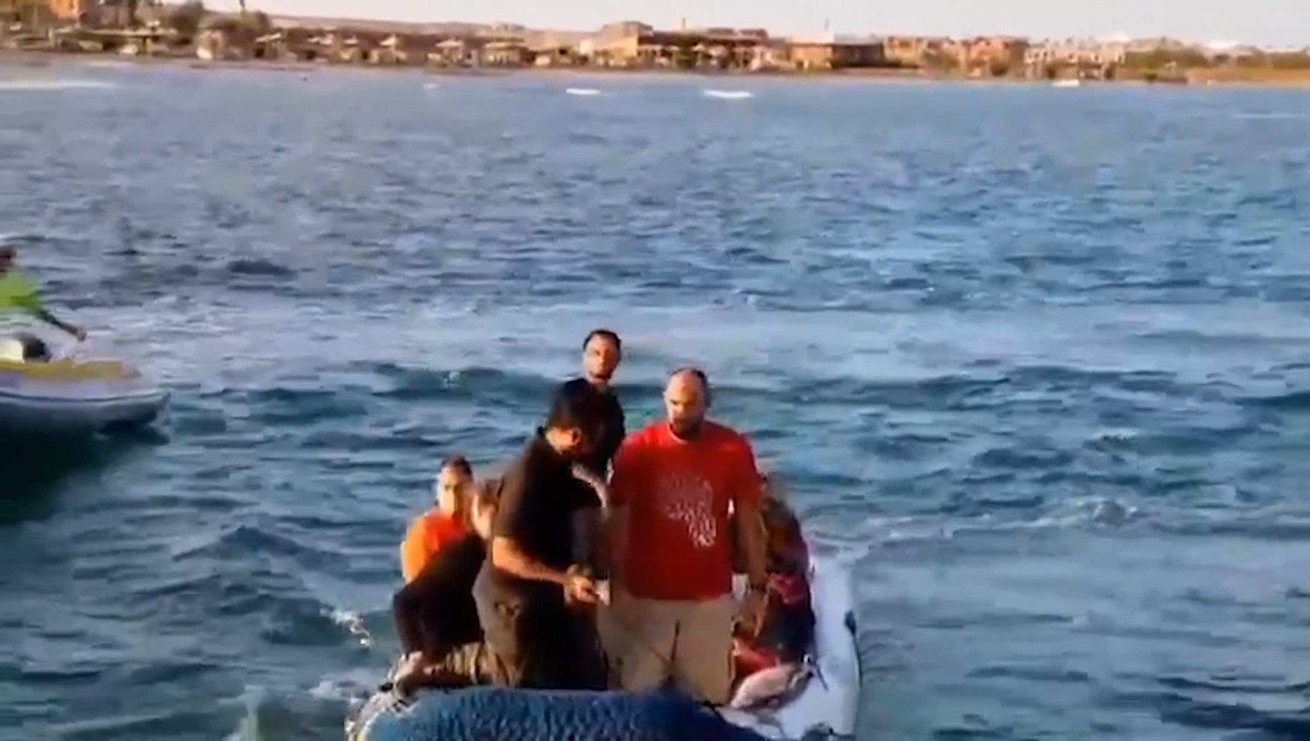 Rescue workers bring survivors to shore