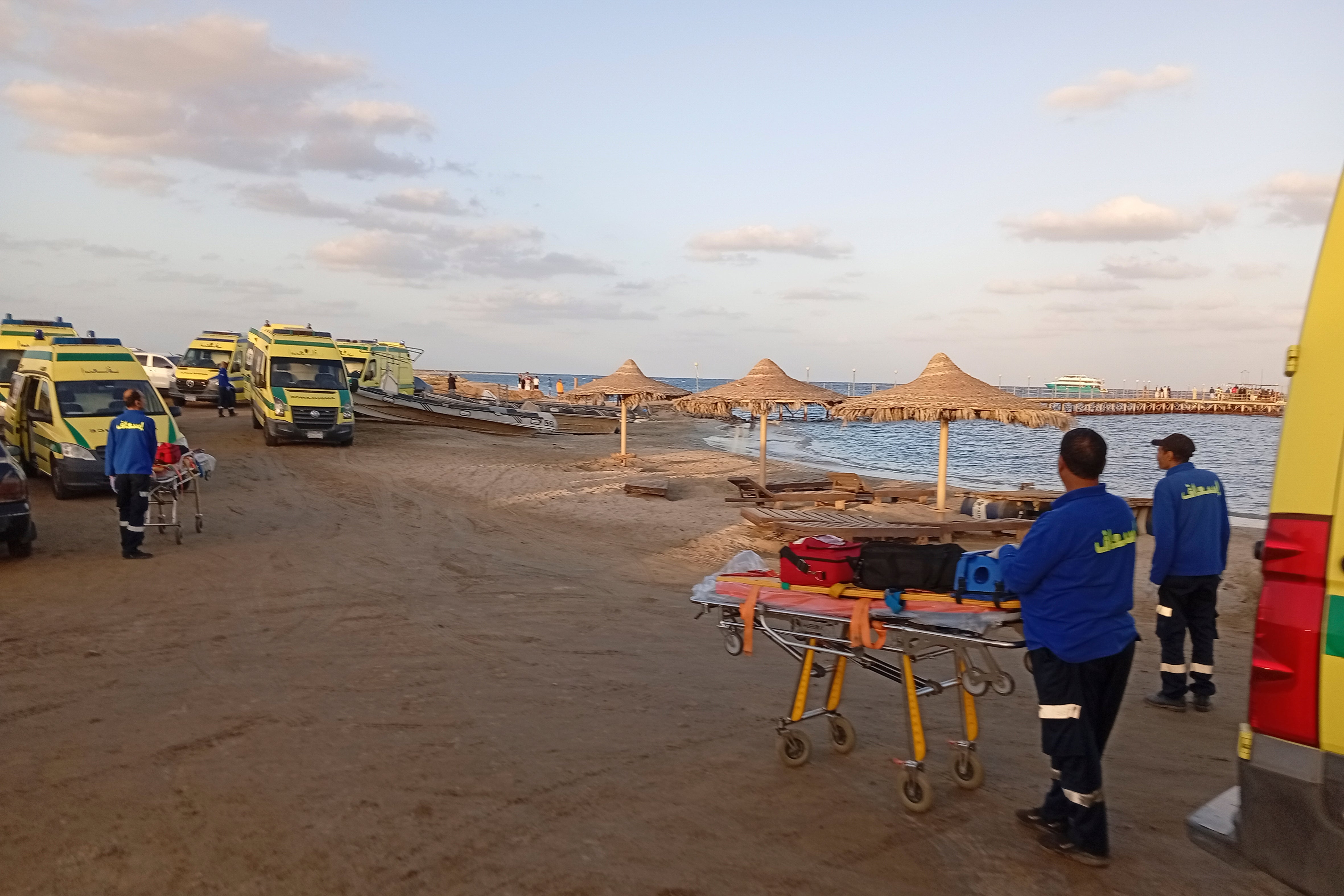 Rescuers wait on the beach of Marsa Alam, Egypt, Monday, 25 November 2024 after a tourist yacht sank in the Red Sea