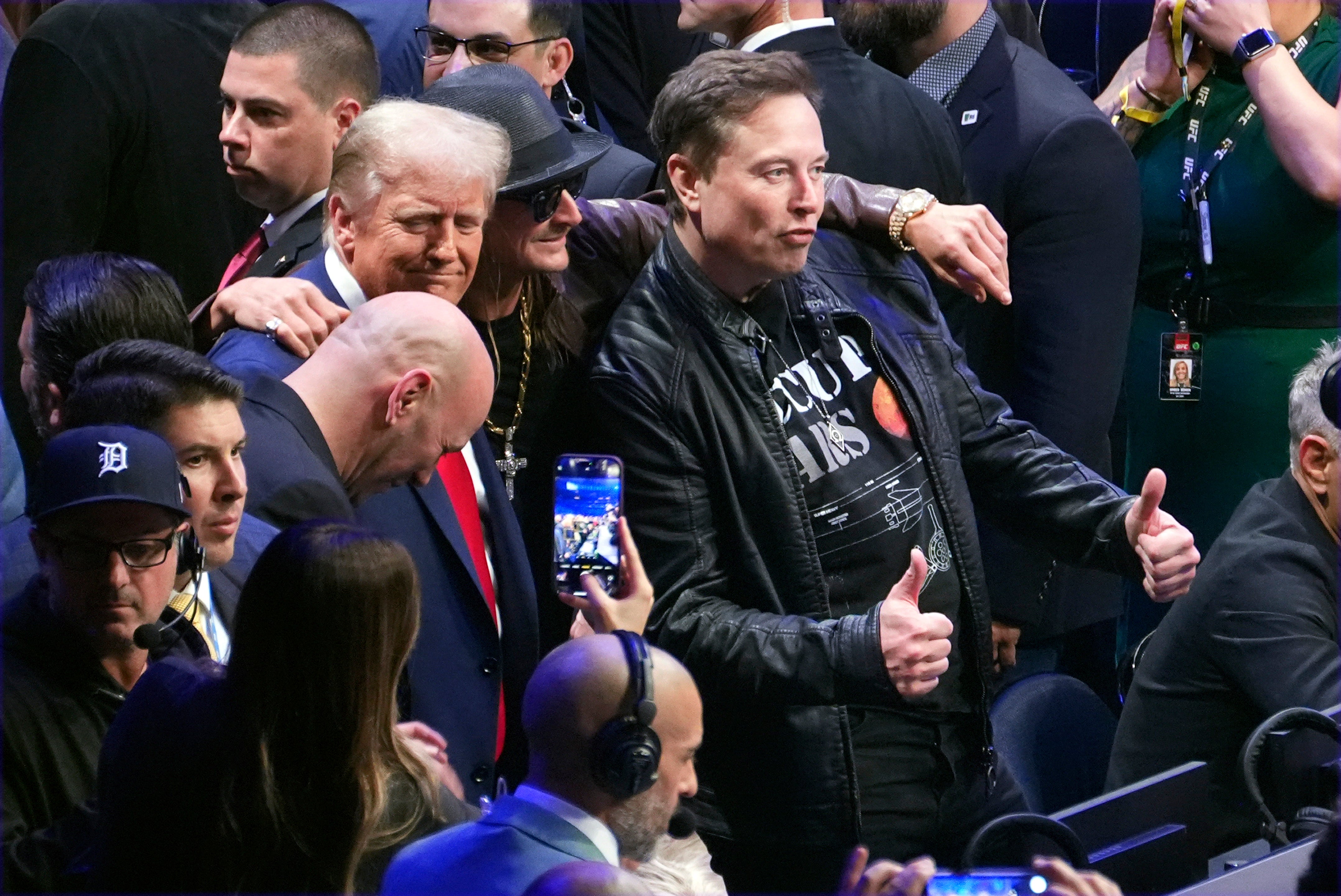 Donald Trump poses for a photo with Kid Rock and Elon Musk at Madison Square Garden on Saturday night