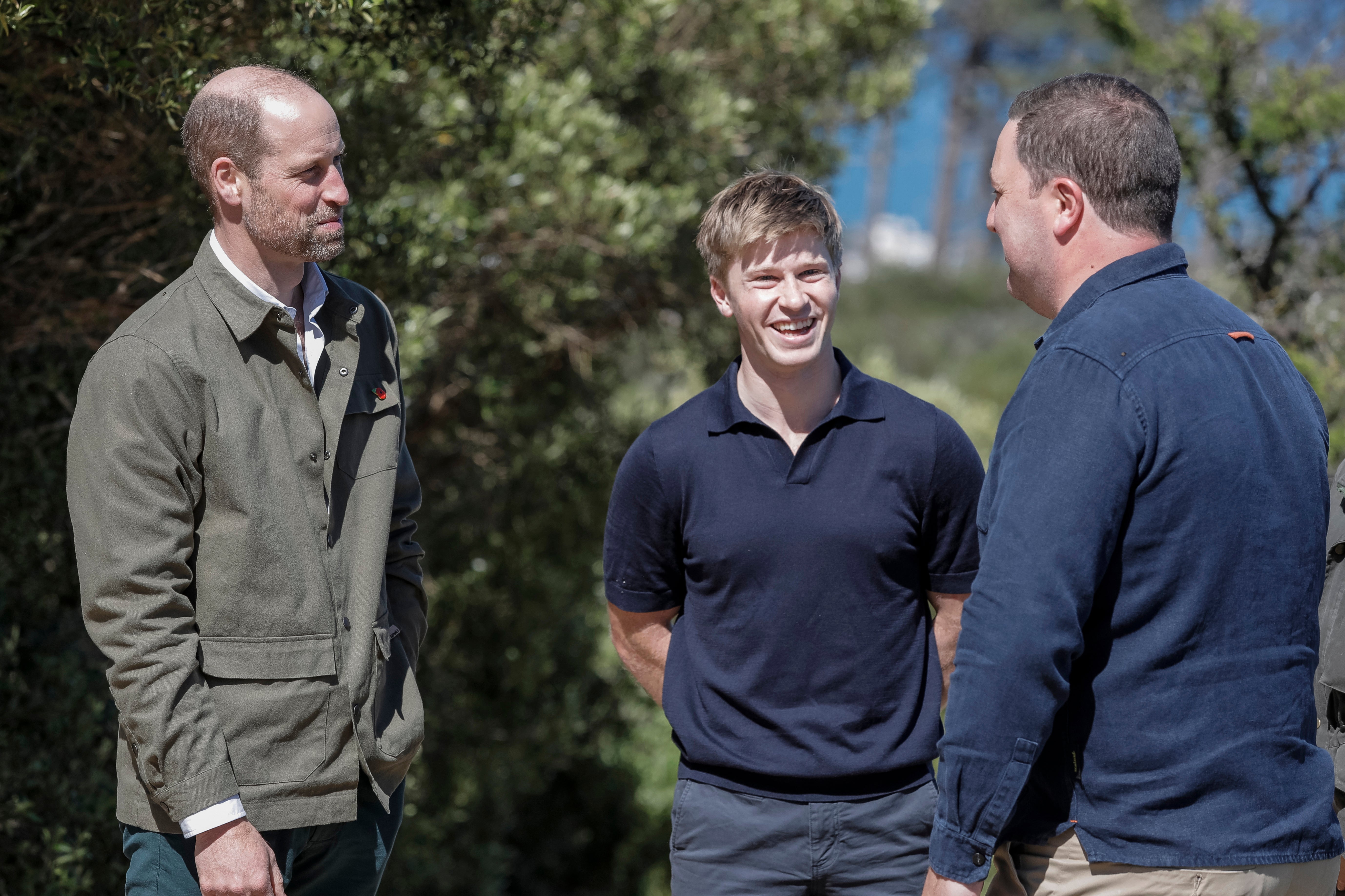 Prince William, left, talks with Australian conservationist and Earthshot Prize Global Ambassador Robert Irwin, center, and Mayor of the City of Cape Town Geordin Hill-Lewis while visiting Signal Hill