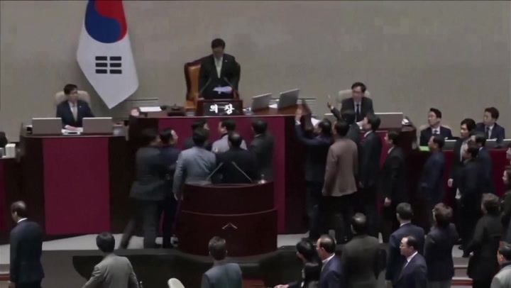 Chanting South Korean MPs swarm parliament in protest of impeachment vote