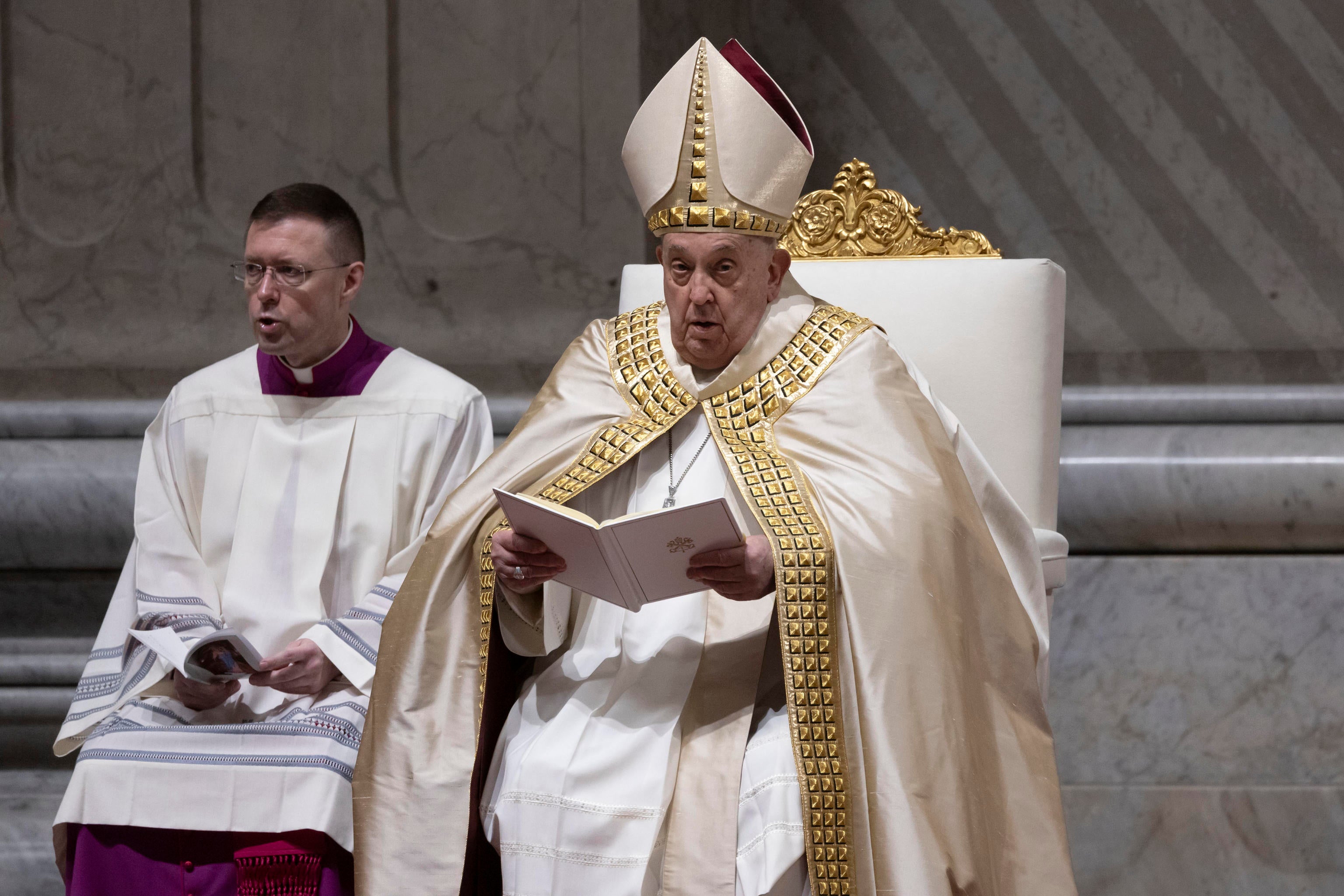 Pope Francis (R) celebrates First Vespers and Te Deum, the rite of thanksgiving for the end of the year, in Saint Peter's Basilica at Vatican City, 31 December