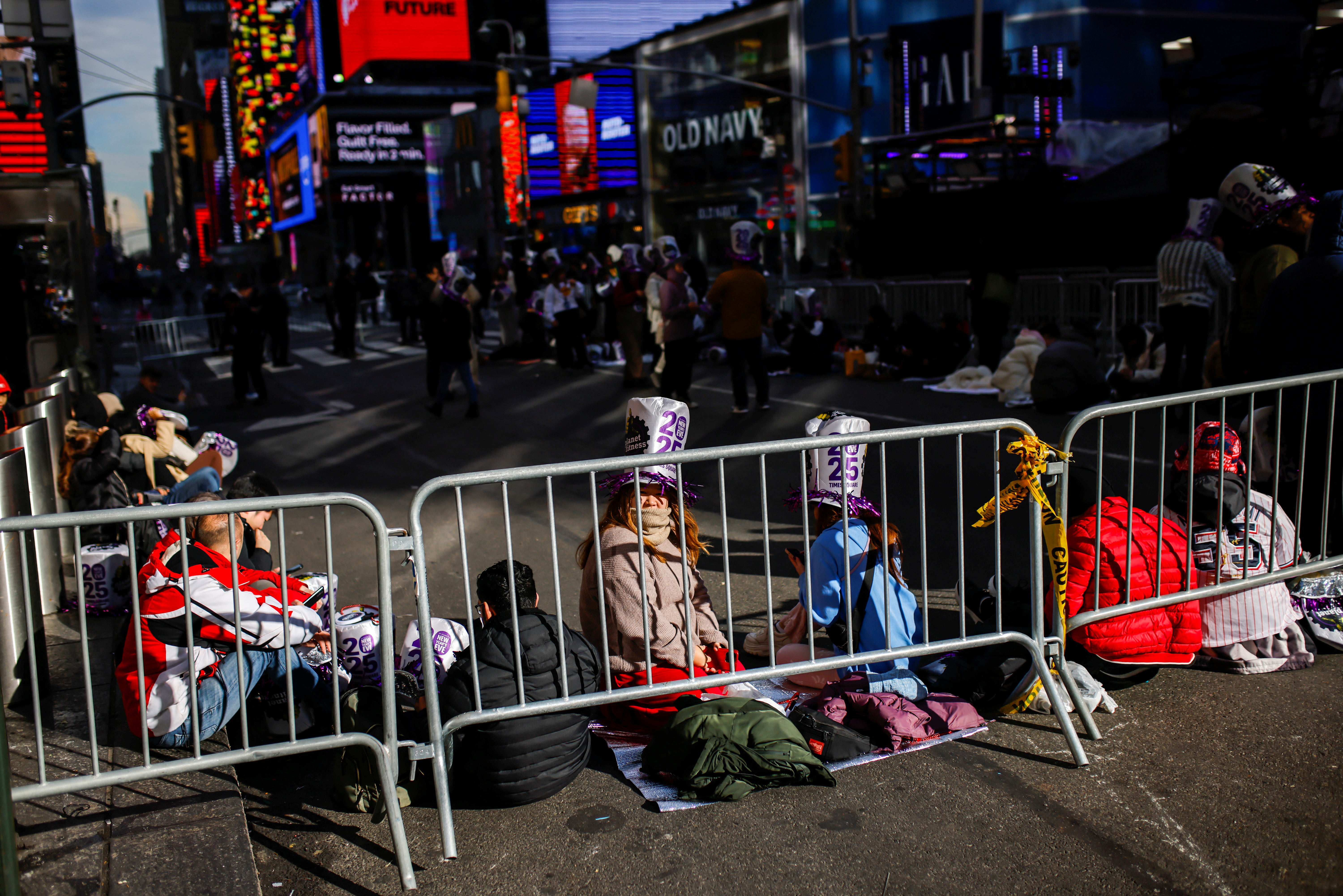 People arrive at Times Square in New York ahead of New Year’s Eve celebrations