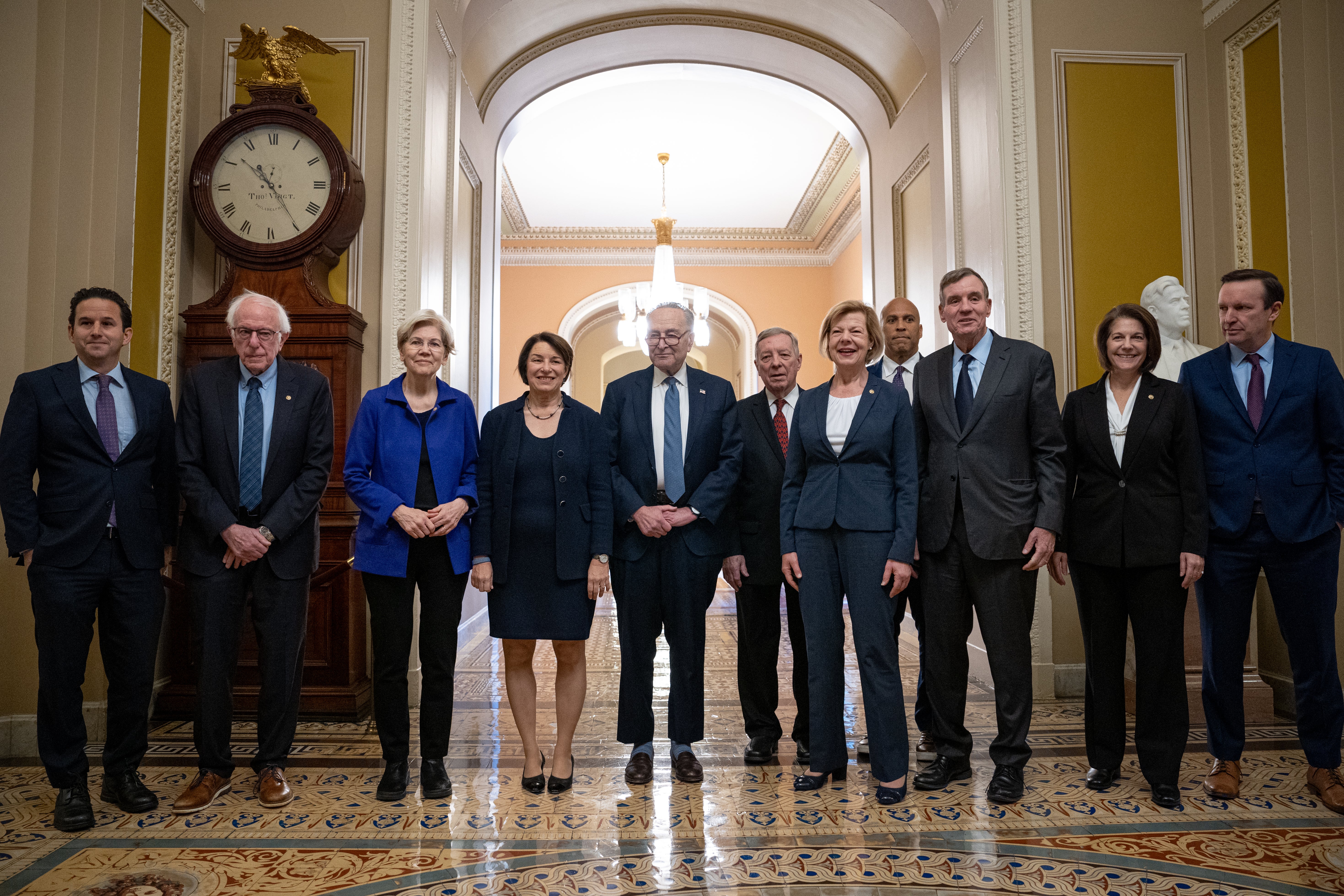 (L-R) Senate Democratic Leadership, U.S. Sens. Brian Schatz (D-HI), Bernie Sanders (I-VT), Elizabeth Warren (D-MA), Amy Klobuchar (D-MN), Senate Majority Leader Chuck Schumer (D-NY), Senate Majority Whip Richard Durbin (D-IL), Tammy Baldwin (D-WI), Cory Booker (D-NJ), Mark Warner (D-VA), Catherine Cortez Masto (D-NV), and Chris Murphy (D-CT)