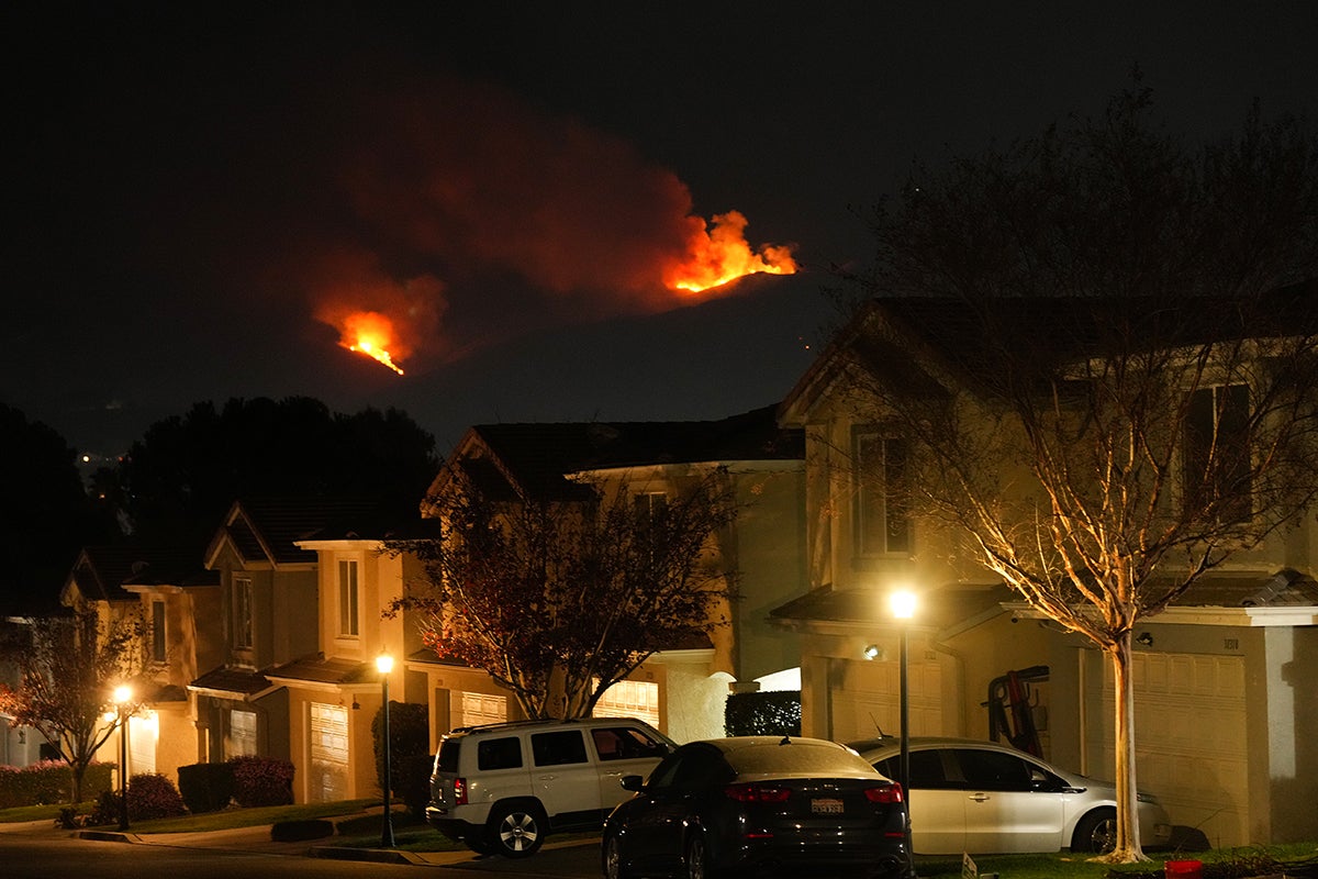 Flames seen in the distance near homes in mandatory evacuation area in Castaic