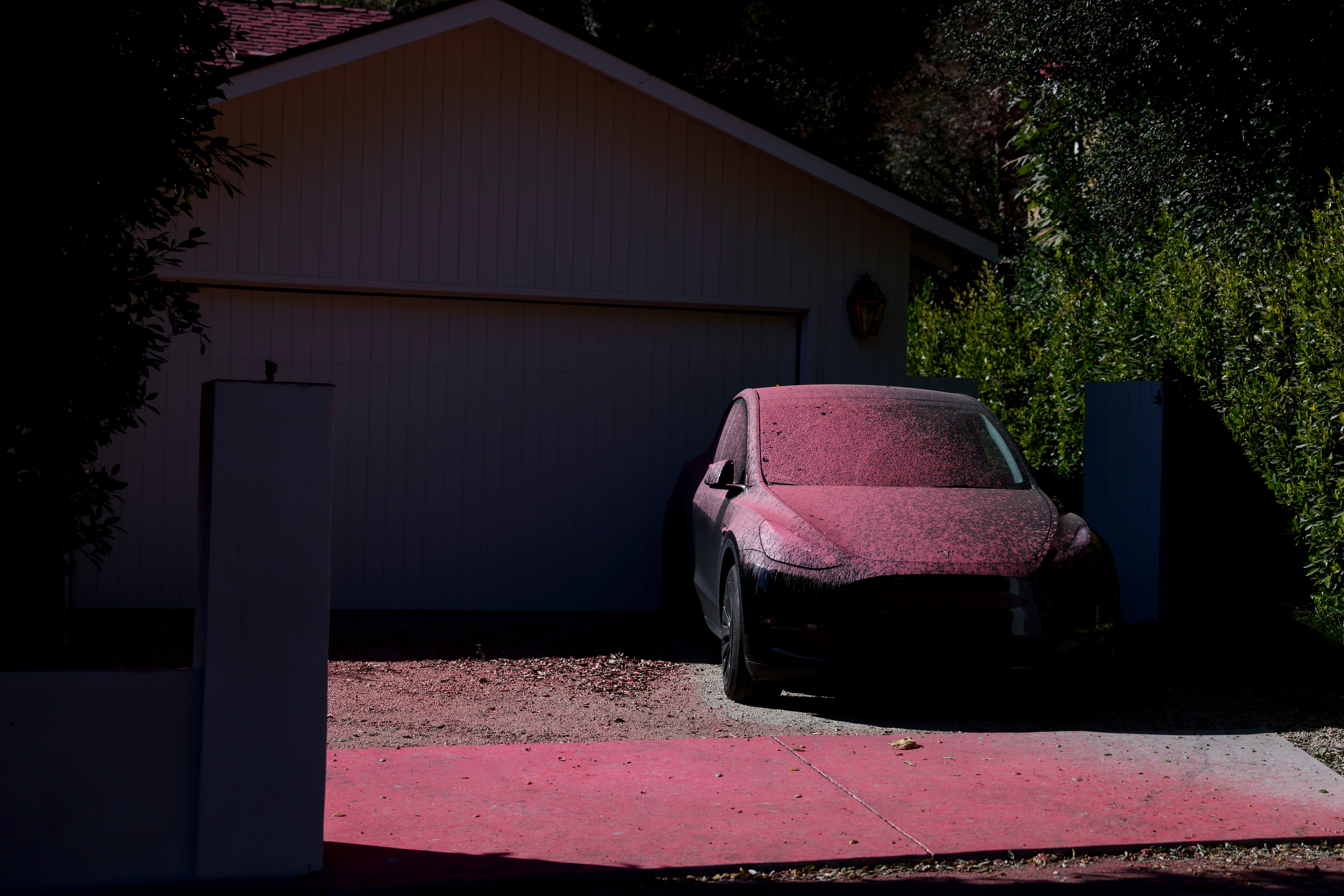 A car is covered in fire retardant in the Pacific Palisades neighborhood in Los Angeles, California, USA, 12 January 2025.