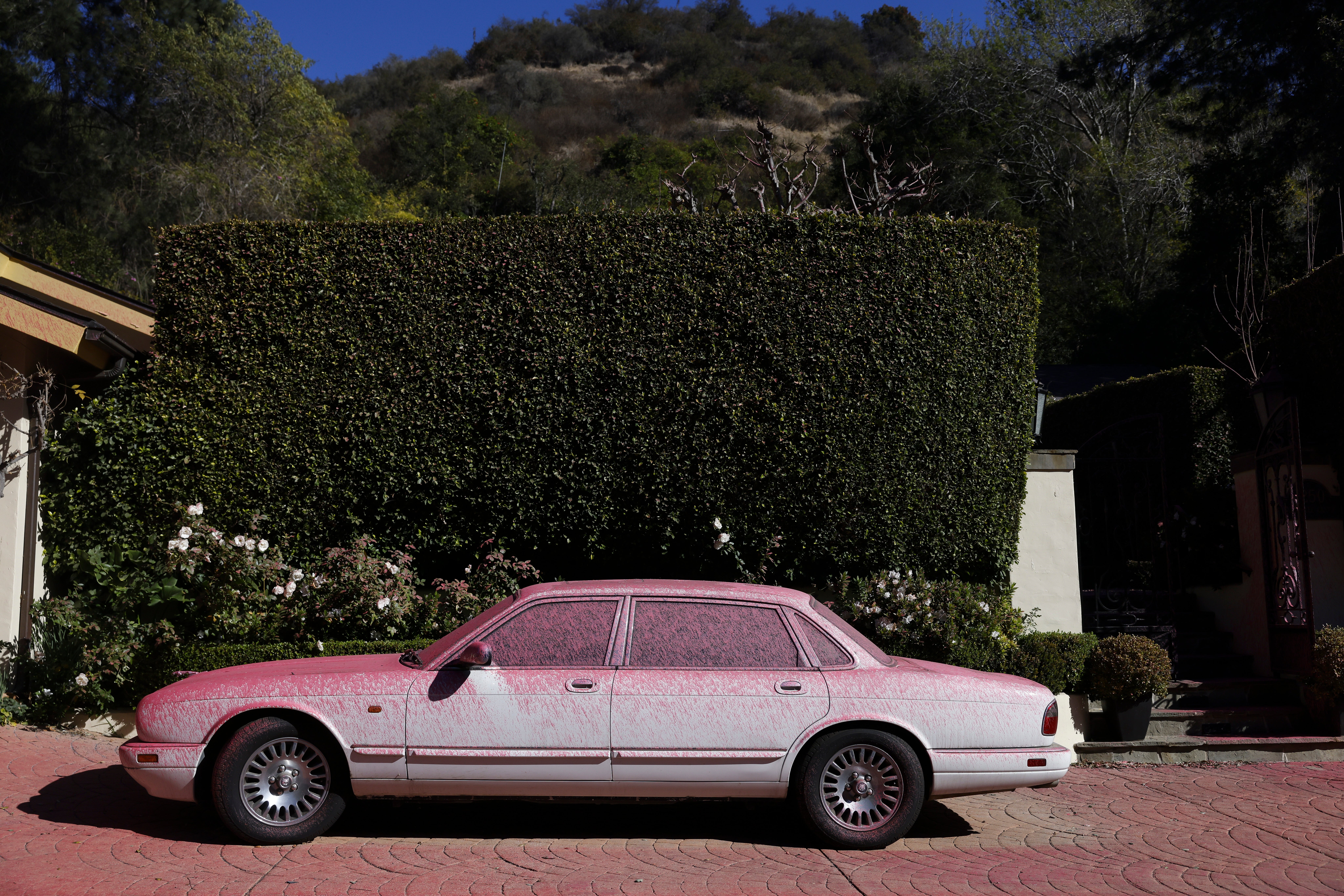 A car is covered in fire retardant in the Pacific Palisades neighborhood in Los Angeles, California, USA, 12 January 2025