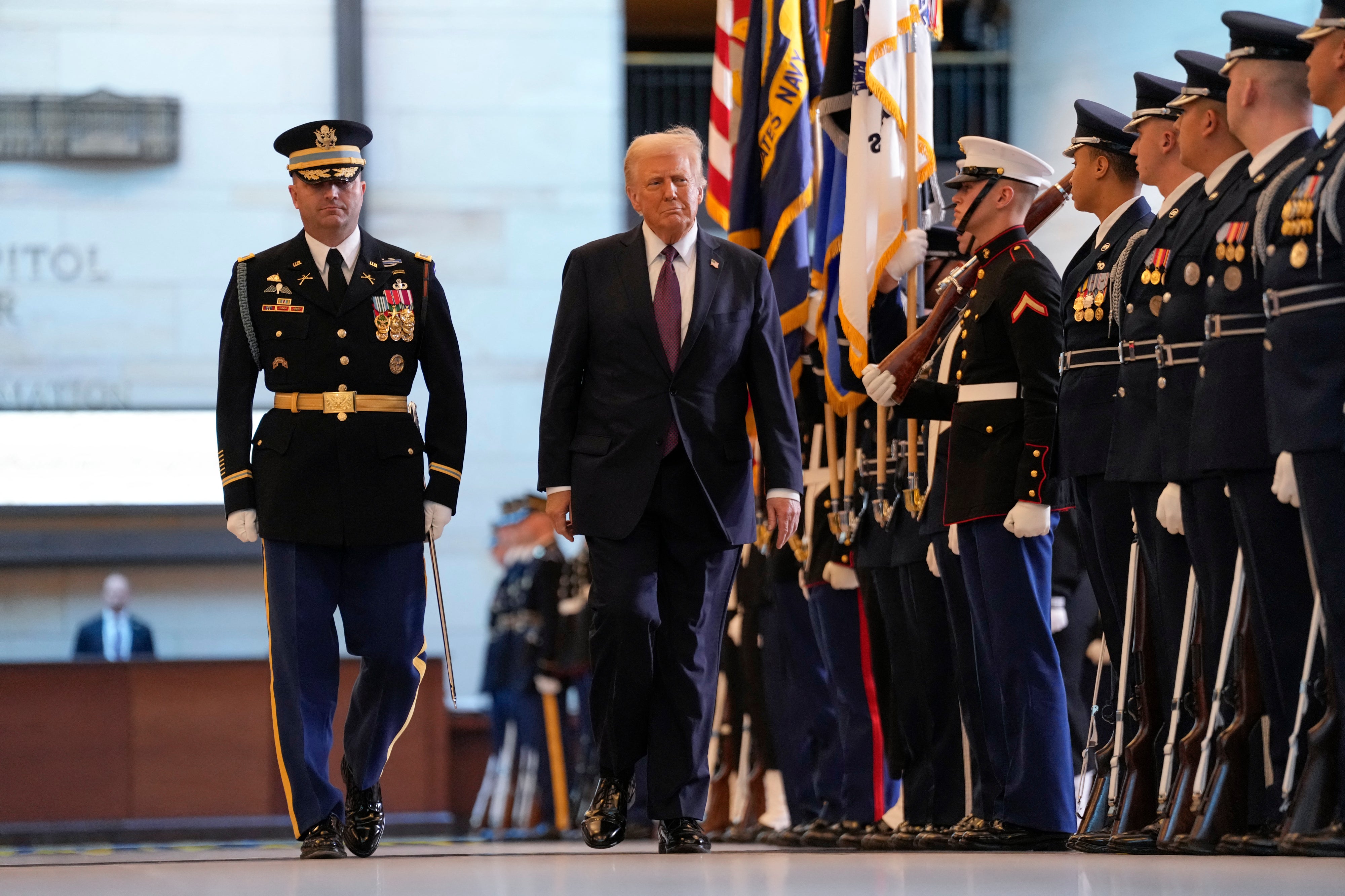 President Donald Trump reviews the troops during his Inauguration ceremony in Emancipation Hall of the US Capitol