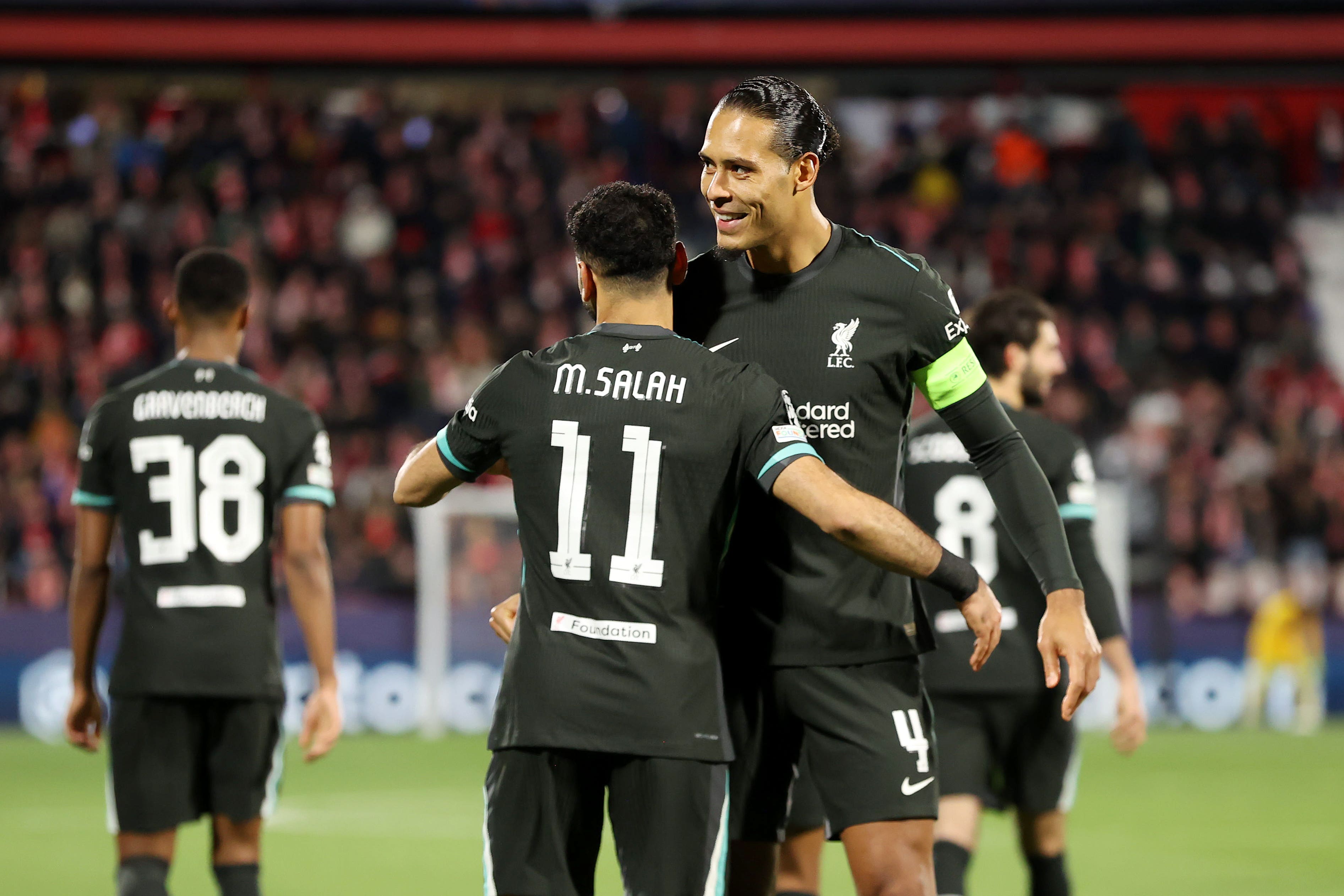 Mohamed Salah and and Virgil van Dijk are among nine senior players left out of the Champions League squad travelling to face PSV Eindhoven (Liam McBurney/PA)